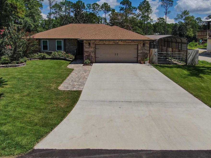 Rare opportunity to acquire an immaculate residence with 122 ft. of WATERFRONT on 3/4 acre of manicured grounds! Over $140,000 in recent upgrades and additions have made this personal retreat a showcase of Florida living!  A spectacular dock features the amenities boaters and fisherman crave, and there is quick access to the bay and gulf. There is also a large electrified workshop, pole barn, patios, firepit and room for a pool. Inside, the warm open floorplan hosts a stunning heated and cooled sunroom with gorgeous views, an oversized living room with a fireplace and an updated kitchen and eating area. Three roomy bedrooms and two full baths offer plenty of space to work, study and entertain. Fresh paint, new moldings, baseboards, ceiling fans, custom lighting and electrical fixtures.