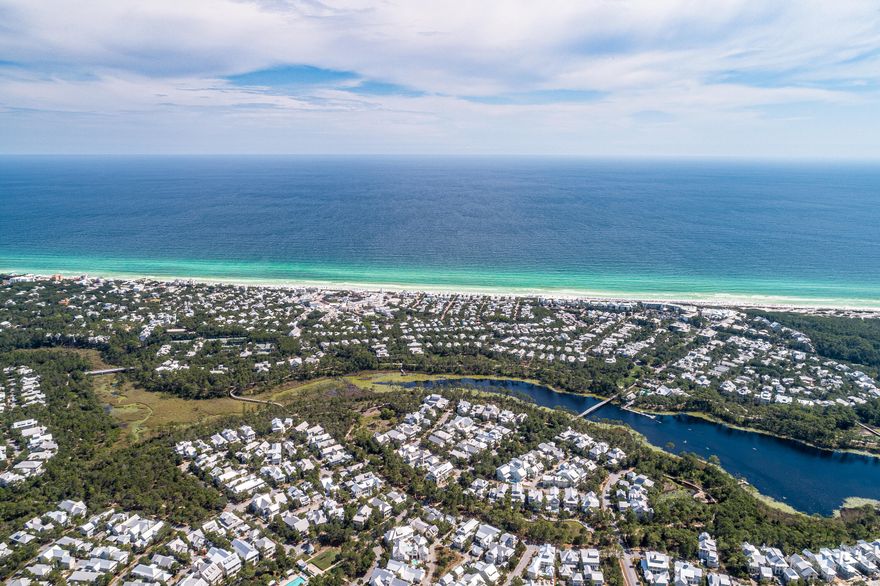 A charmed life awaits at this lovely 3BR/3BA (+ loft) WaterColor Cottage located directly across from Long Leaf Park in the Lake District. A welcoming front porch with two hanging porch swings leads to an open living and dining area with airy vaulted ceilings, tongue and groove wall detail, and gorgeous pine wood floors. The kitchen features Thermador stainless steel appliances, granite countertops, custom cabinetry, a large breakfast bar, and a tiled backsplash. A spacious first level master suite offers a private screened porch and an ensuite with dual vanities and a separate walk-in shower and soaking tub. A bunk room with bathroom on the first level is perfect for the kids while an additional guest suite is located on the second floor along with a loft area currently used as a sitting area and desk space. Outstanding outdoor spaces including an expansive back porch make it easy to enjoy the mild Northwest Florida climate year-round. Bike to the beach club or the BoatHouse or stroll to the Sand Hill Circle Frog pool. Freshly painted interiors and exteriors make this home move-in or rental ready!

Located on 499 acres in the renowned South Walton beaches, the WaterColor community offers the charm of small-town life. Exceptional community amenities include six beautiful swimming pools, a recently renovated gulf front beach club, nature trails, a Boathouse offering kayaking, canoeing and paddle boarding, a fitness center, outstanding tennis facility, Camp WaterColor for kids with lazy river and waterslide, parks, and green spaces.