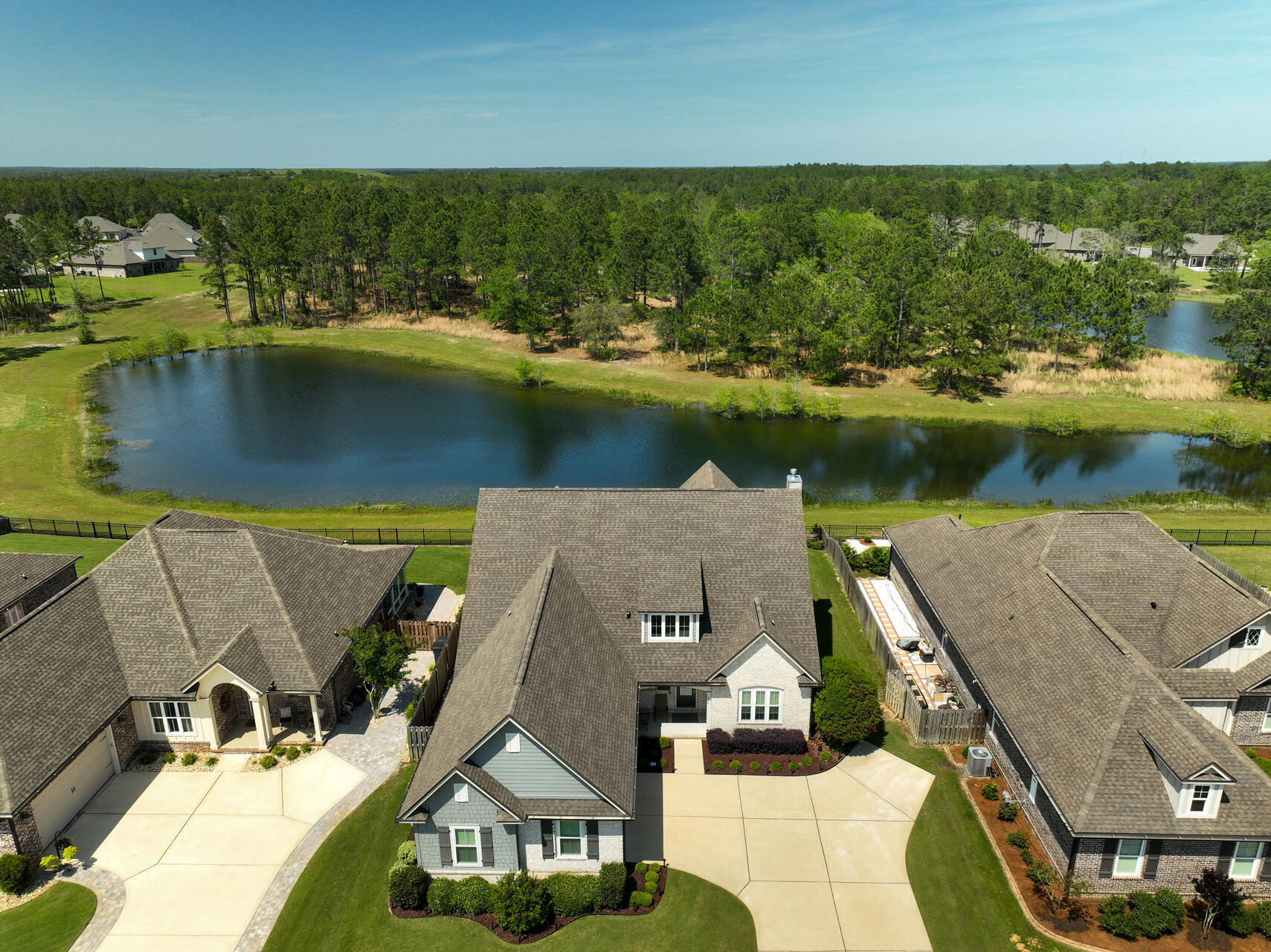 Set against the tranquil backdrop of a preserve lot, this stunning 2018 Randy Wise craftsman home perfectly blends luxury and practicality. Overlooking two expansive lakes, it offers an exceptional indoor-outdoor living experience.Step inside to a spacious open-concept layout, where a freshly renovated kitchen seamlessly connects to the living and dining areas. This chef's dream features top-tier stainless steel appliances, including a Frigidaire Professional, a large pantry, and elegant quartz countertops paired with an under-mount Blanco sink. The cozy living room invites relaxation with its charming gas brick fireplace, ideal for family gatherings. The master suite boasts a generous walk-in closet, dual sinks with quartz countertops, a large shower, and breathtaking views of the  lake and preserve. A versatile flex room can serve as a fourth bedroom with a private bath or be used as an office or game room.

Outdoor living is enhanced by a spacious 20x20 screened-in patio with a gas stub, elevated lake views, and a beautifully landscaped backyard. Additional features include Ninja-covered garage and patio floors, an alarm system, and impact windows and doors. As a bonus, a large safe, Big Green Egg Grill, and a whole-house Generac generator are included!

Recreational amenities are just steps away, with over 12 miles of walking and cycling paths, two zero-entry pools, a lap pool, tennis and pickleball courts, a 10,000 sq. ft. gym, a large clubhouse with a movie theater, a General Store, and a state-of-the-art Brew Pub.