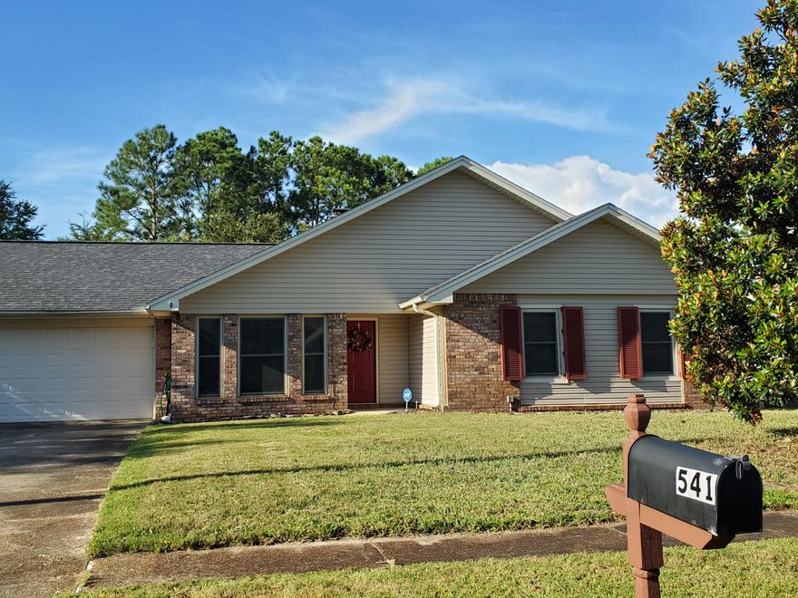 Enjoy your morning coffee or an evening barbeque with this amazing outdoor space!  This beautiful home has a spacious backyard with several features including a screened porch, separate deck, open patio and privacy fence.  The living room showcases a large, brick fireplace, vaulted ceiling and a step-down entry.  Entertain guests in the dining room that overlooks the front yard and provides easy access to the eat-in kitchen that has updated appliances.  The master suite features a large bedroom and full bathroom with a garden tub and walk-in shower.  The property is just a few miles from Hurlburt Field and a short drive to the attractions of either Navarre Beach and Fort Walton Beach.