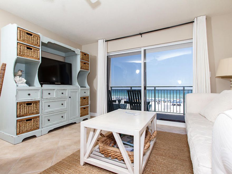 Relaxing gulf front unit- BBQ area, boardwalk, beach access, , reserved covered parking. From a breezy beachfront balcony, you may not only enjoy the vivid views but also listen to the soothing sounds of the surf. The main living area has over sized light tile flooring and a comfortable queen size sleeper sofa for additional guests. Tastefully matching accent chair and decorative art provide a wonderful Floridian ambiance. A handsome cabinet houses a wide TV. Cooking for the entire family is easy in the kitchen equipped with all that you need to prepare delicious meals. The master bedroom suite is quite lovely with tasteful furnishings, a queen size bed and direct access to a full bathroom. Another bath with walk-in shower off the hall is very convenient, there are twin bunks.