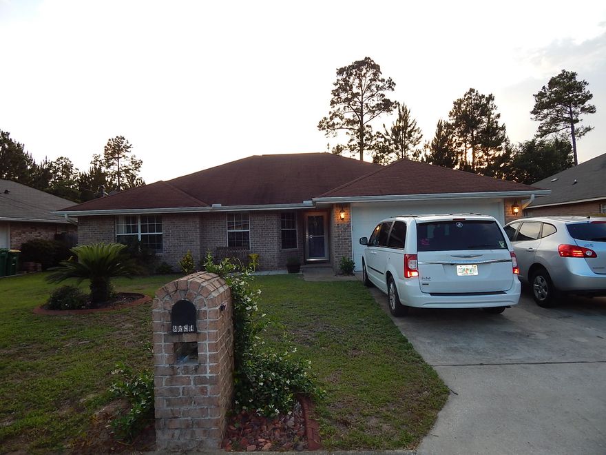 MOVE-IN-READY 3BR/2BA All Brick Home in established Navarre neighborhood! A Quick Closing is possible! This Beautiful Family Home is located close to Beaches, Bases and Shopping! The Large Living Room has a Vaulted Ceiling, Low-Maintenance Wood Laminate Flooring and opens to the patio! The Eat-In-Kitchen has a breakfast nook, Stainless Appliances, an Oversized Acrylic Sink, Lots of Cabinets and a Lovely Backsplash! The Bedrooms have newer (1 yr) carpet. The Master Bedroom is Spacious with Double-Closets and plenty of room for a King Sized Bed. The Master Bath has a Double Vanity, Medicine Cabinet, large walk-in linen closet and Shower/Garden Tub Combo.