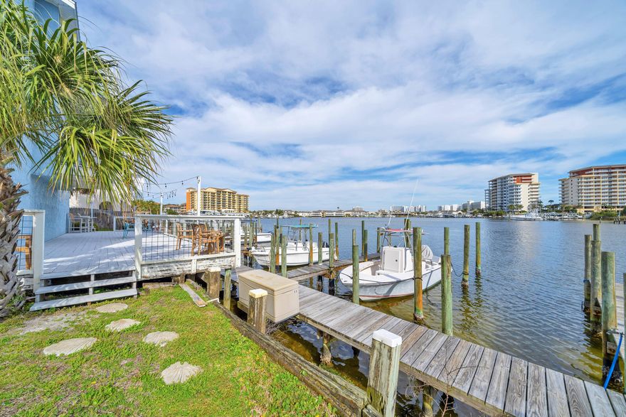DEEDED Beach Access, Assigned Parking, & Boat Slip,  #2,  $75/month. The homeowners' association oversees ownership of the boat slips, making them accessible to owners for a monthly fee.  Slip is 9'6'' & can host up to a 30' boat. Welcome to your dream waterfront living at this meticulously renovated 2-bedroom, 2.5-bath condo, corner unit,  with captivating harbor views. No detail has been spared in this upgraded oasis where comfort and style converge seamlessly.Upon entry, you're greeted by the modern charm of freshly painted walls, doors, and trim, complemented by the removal of popcorn ceilings and a sleek orange peel finish. Natural light floods the living space through newly replaced (4) sliding glass doors, providing seamless access to the serene balcony overlooking