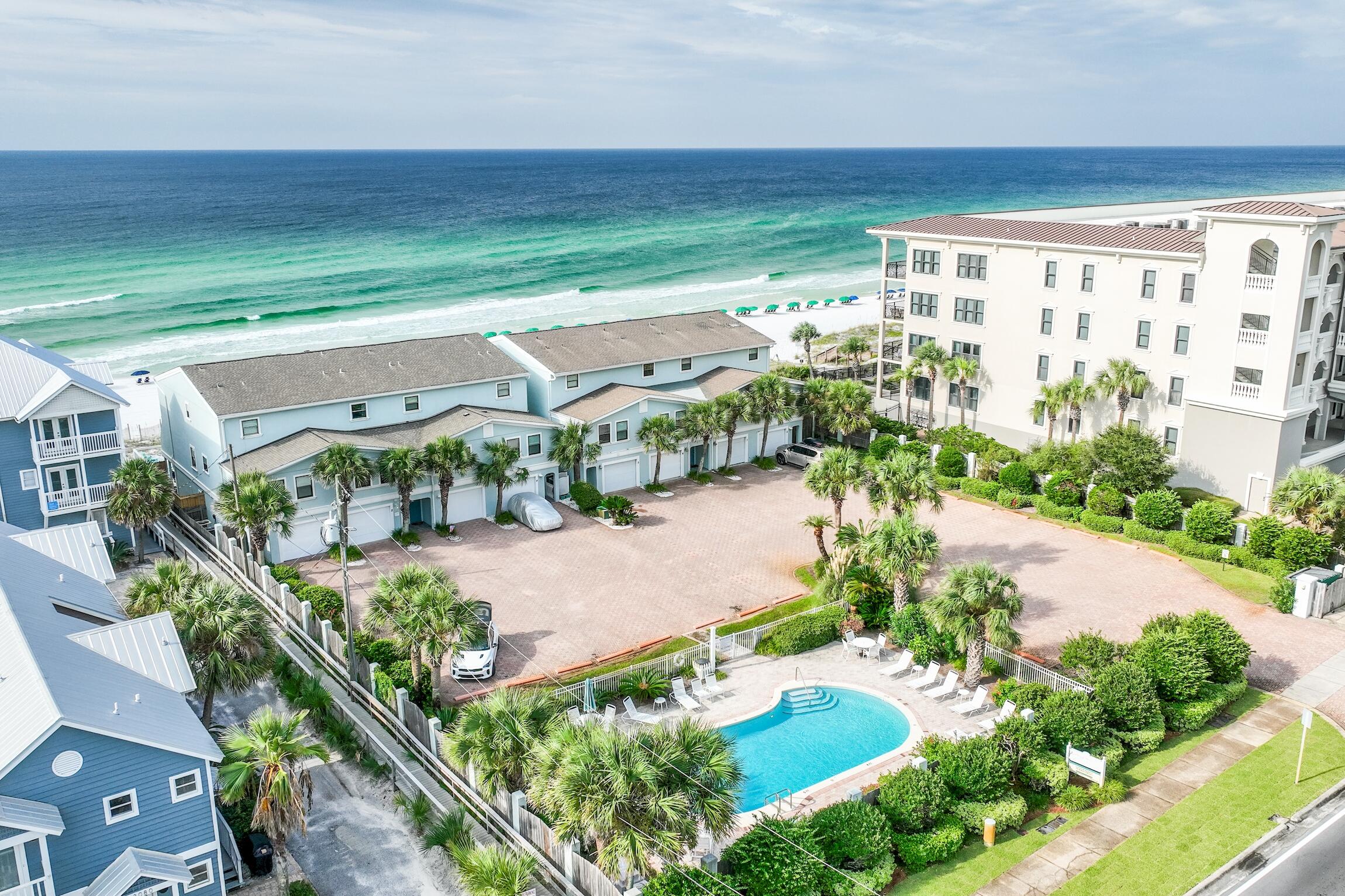 This beautifully fashioned 3 story townhome impresses from end to end with its floor-to-ceiling windows on all Gulf facing walls, 2 beach-front balconies directly on the Gulf, and Gulf front deck with walk-over beach access. The kitchen is beautifully appointed with stainless steel appliances, granite countertops, breakfast bar with seating for 4, and conveys fully equipped! The neutral wood-look luxury vinyl plank flows throughout the entire unit, giving for a cohesive feel. The spacious master suite offers an unobstructed Gulf view directly from your bed as well as dedicated balcony access. The master bathroom features a tasteful, oversized walk-in luxury shower with floor to ceiling tile and bench, and a marble topped vanity. You'll also enjoy additional bedrooms on floors 2 and 3,