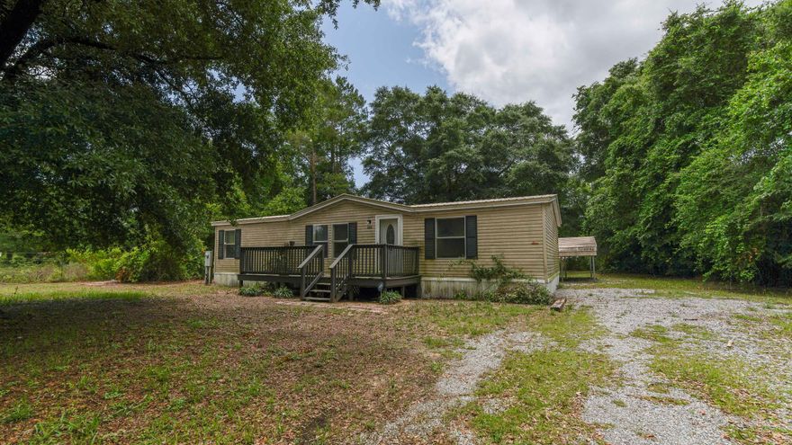 Fixer Upper's Dream! Seller is only accepting cash offers or will Owner Finance with $19,000 down! This affordable home is conveniently located in the Mossyhead area of Defuniak Springs, FL. The large, open living room greets you upon entry with a gas fireplace, and then with a spacious  kitchen overlooking the back yard. The wood beam in the living room is where past owners opened up the living room and used the 3rd bedroom as living space. It can easily be converted back to a 3rd bedroom. Split floor plan with spacious master suite with soaking tub & separate shower. Outside you'll find a spacious front porch that needs some love, 2 car carport and storage shed in your open back yard. With a little TLC; this can be a nice home for someone. Call today and make it yours!