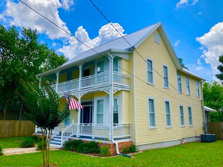 HISTORIC HOUSE OF YOUR DREAMS! Big Price Reduction for this exquisite 4 BR, 3.5 BA home in the heart of the DeFuniak Springs Historic District. Just one block from Lake DeFuniak. Enjoy small town living with a vibrant downtown business district and lots of social activities. This property has been fully updated, including newer plumbing, electrical & windows, plus a new metal roof in 2023. Granite countertops & stainless appliances in 2021. One BR, one full BA, & one half-BA downstairs, plus 3 bedrooms & 2 more baths on the 2nd floor. Crown molding throughout. Two spacious front porches, a rear screened porch, fenced yard, carport, storage shed and plenty of rear parking complete this most desirable home. Small town lifestyle, plus our white sand Gulf beaches are just 30 minutes away!