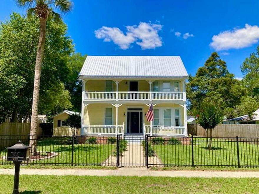 THE HISTORIC HOUSE OF YOUR DREAMS! This exquisite 4 Bedroom, 3.5 Bath home is in the heart of the DeFuniak Springs Historic District, just one block from Lake DeFuniak. Enjoy small town living with a vibrant downtown business district and lots of social activities. This property has been fully updated, including newer plumbing, electrical & windows, plus a new metal roof in 2023. Granite countertops & stainless appliances in 2021. One BR, one full BA, & one half-bath downstairs, plus 3 bedrooms & 2 more baths on the 2nd floor. Crown molding throughout. Two spacious front porches, a rear screened porch, fenced yard, carport, storage shed and plenty of rear parking complete this most desirable home. Small town lifestyle, plus our white sand Gulf beaches are just 30 minutes away.