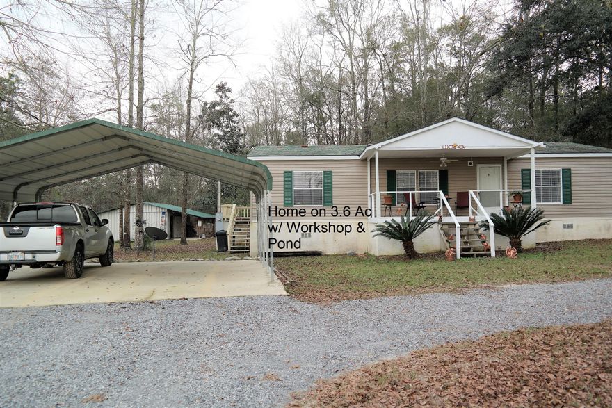 Motivated seller reduced another $10,000! Home qualifies for FHA and VA financing. Finally...Everything you've been looking for at a very affordable price! This immaculate home sits on 3.6 acres with a spring-fed pond & bordered by a beautiful Cypress Pond. There is a 22x24 workshop with attached, covered equipment parking & utility trailer pad. There is a covered front porch, as well as an open back deck for great views of the water & woods behind home, where deer & wildlife abound. The inside of the home is just as impressive with open floor plan, quality laminate floors,all walk-in in closets, Walk-in shower and garden tub in master bath, kitchen island & more. This is a definite must see, so schedule your showing today!
