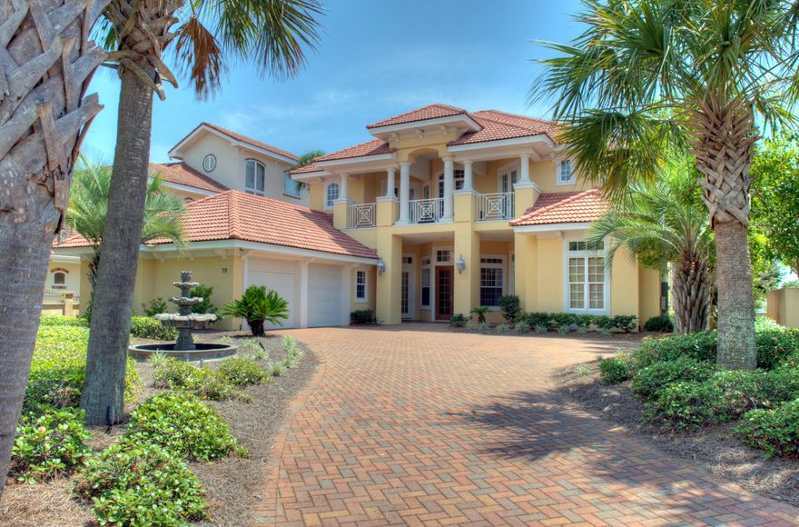 Gorgeous Mediterranean style custom home situated high above Lake Destiny offering great Gulf views! Perfect as a primary residence, second home or investment property with lots of living space both indoors and out! Fabulous floor plan with living room, formal dining room and adjoining butler's pantry with wine cooler, large open family room/casual dining area/gourmet kitchen, office/den, additional office/homework room, first level grand master suite, sweeping staircase leads to second level master suite plus two additional guest rooms and a bunk room and a large media room. Gourmet kitchen features granite counters with large breakfast bar, center island, upgraded stainless appliances include Wolf gas range, two Fisher & Paykel dishwasher drawers, warming drawer, large walk-in pantry