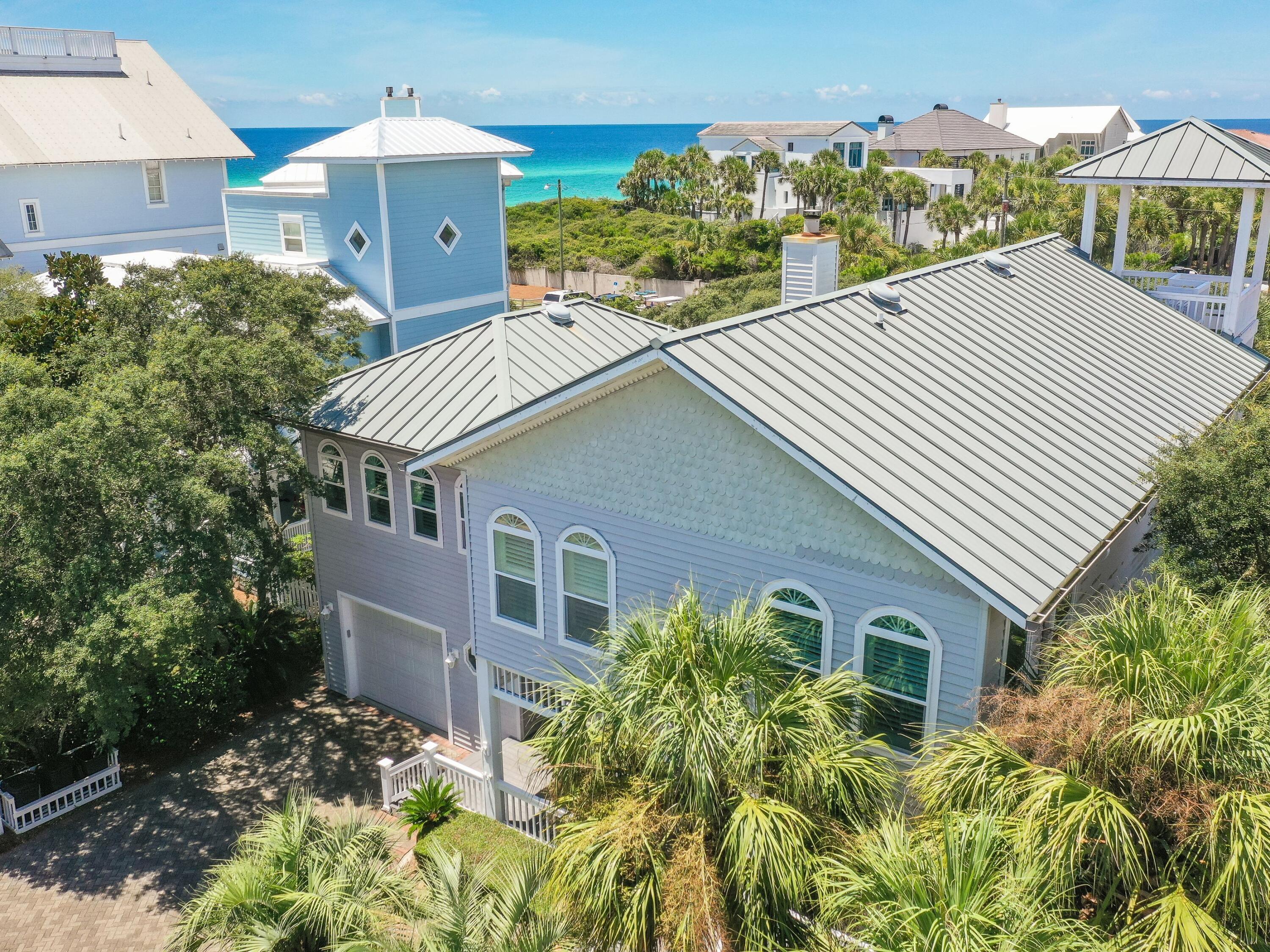 UNDER CONTRACT, ACCEPTING BACK UP OFFERS DURING CONTINGENCY PERIOD. Get ready to enjoy unobstructed Gulf of Mexico views from your master bedroom suite! This property enjoys forever gulf views from the second and third floors of the main house and the carriage house. The large detached garage has a self-contained one-bedroom apartment with a full kitchen on the second floor. Located in the sought-after, private beachfront, gated community of Old Florida Beach, this beach house is just three homes from the beach and has huge potential to update and make it your own. The main house has three generously sized bedrooms, each with its own bathroom. The living area opens into a large kitchen/dining area. The home is well built with 9 feet ceilings throughout.