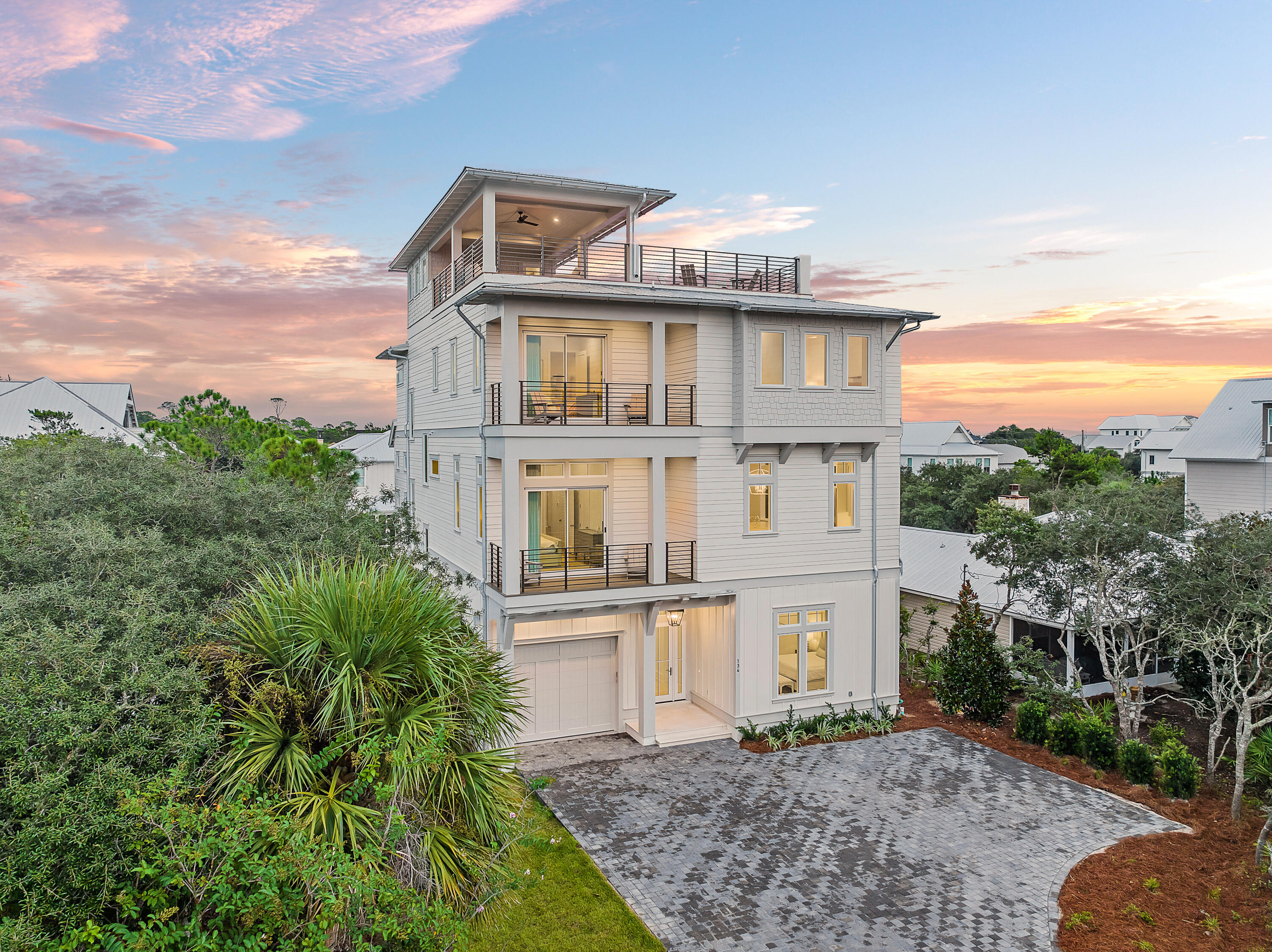 $200,000 PRICE REDUCTION AND LISTED $275,000 BELOW MOST RECENT BANK APPRAISAL! Welcome to 134 A Street - a stunning new construction home located on the desired east end of 30A that offers the ultimate in luxury living and potential rental projections of $440,000+! Offering 8 total bedrooms, this property is a dream come true for those seeking a lavish and comfortable lifestyle. Upon entering the property, you'll be struck by the beautiful custom tile and hardwood flooring throughout the home. The 12' ceilings on the 1st and 2nd floors create an airy and spacious feel, while the large kitchen with high-end Thermador appliances and a sizable island with two dishwashers is sure to impress even the most discerning of chefs.