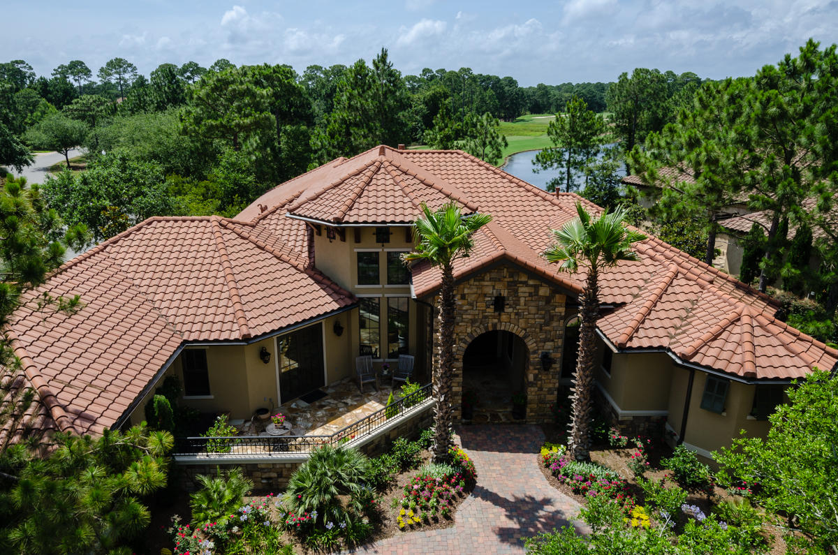 Lakefront in The Preserve, this single story Tuscan home exudes quality and casual elegance throughout with views over #4 at Burnt Pine golf course. This home has it allquality built using ICF concrete construction for energy efficiency and strength. Spectacular 8ft curved windows overlooking the salt water pool, spa and outdoor living area. Tesoro antiqued travertine floors throughout, knotty alder custom cabinetry, doors, baseboards and crown molding. Reclaimed wood accents and beams from a Mennonite farm in Wisconsin. So many details ... Please click through the photos to see more, as well as the virtual tour and the detailed description located in the documents.