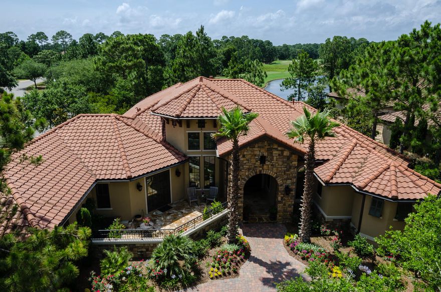 Lakefront in The Preserve, this single story Tuscan home exudes quality and casual elegance throughout with views over #4 at Burnt Pine golf course. This home has it allquality built using ICF concrete construction for energy efficiency and strength. Spectacular 8ft curved windows overlooking the salt water pool, spa and outdoor living area. Tesoro antiqued travertine floors throughout, knotty alder custom cabinetry, doors, baseboards and crown molding. Reclaimed wood accents and beams from a Mennonite farm in Wisconsin. So many details ... Please click through the photos to see more, as well as the virtual tour and the detailed description located in the documents.