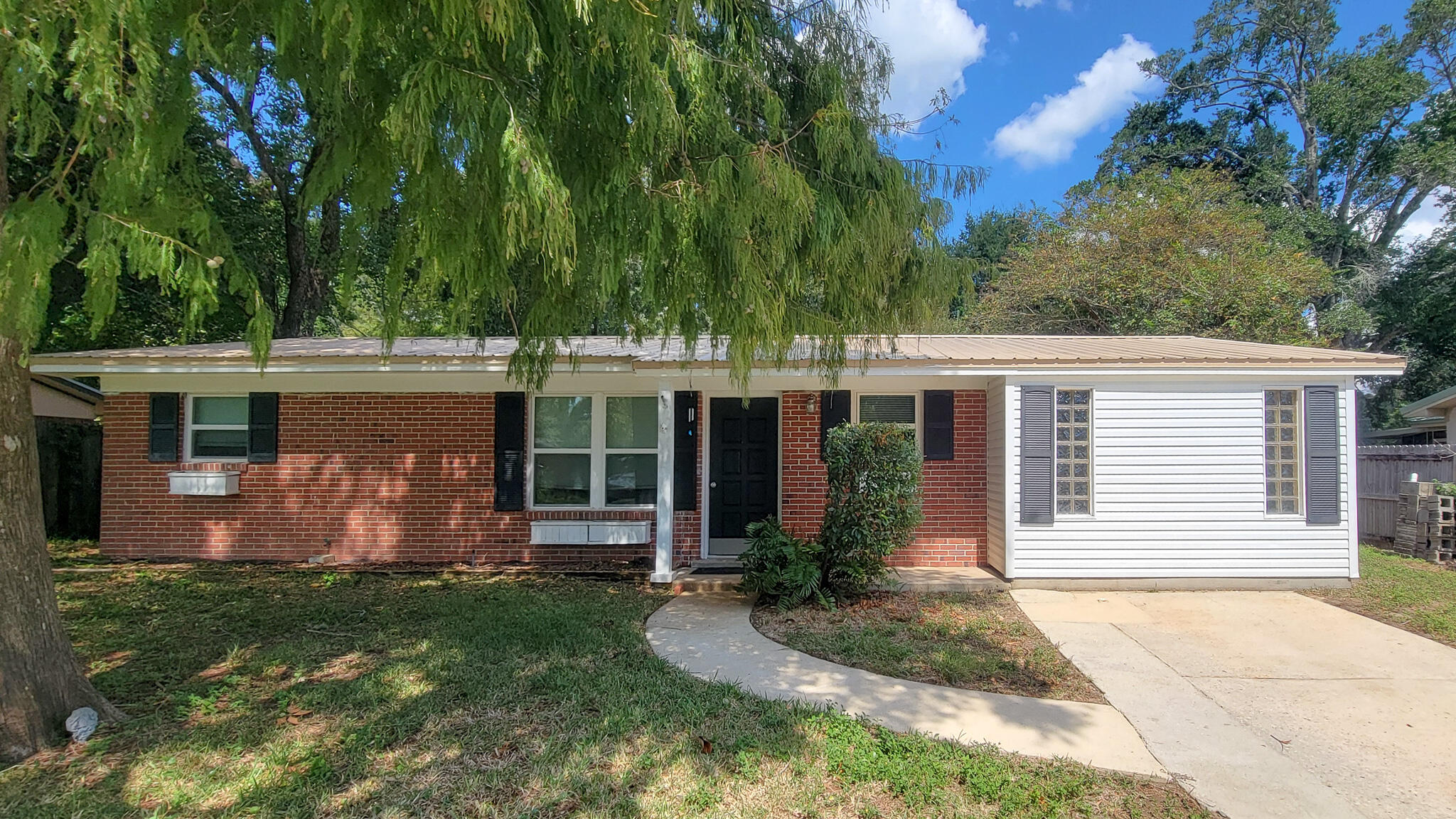 Nice ranch style home in the heart of Fort Walton Beach!! Open concept living space with extensive updates, kitchen is complete with custom cabinetry, granite countertops, glass top oven with range hood, stainless steel appliances, and large pantry! Added luxury vinyl plank flooring throughout most of the house.  Master bedroom suite has private full bath, nice size shower and walk-in closet. Split floor plan with guest bedrooms and guest bath on the opposite end of the home. Spacious laundry room off the kitchen is tiled with access to the backyard. HVAC 2023... Metal Roof 2015... Water Heater 2016. Sheds in backyard and sprinkling system to be sold in AS IS condition. Survey available, saving buyer $500+!