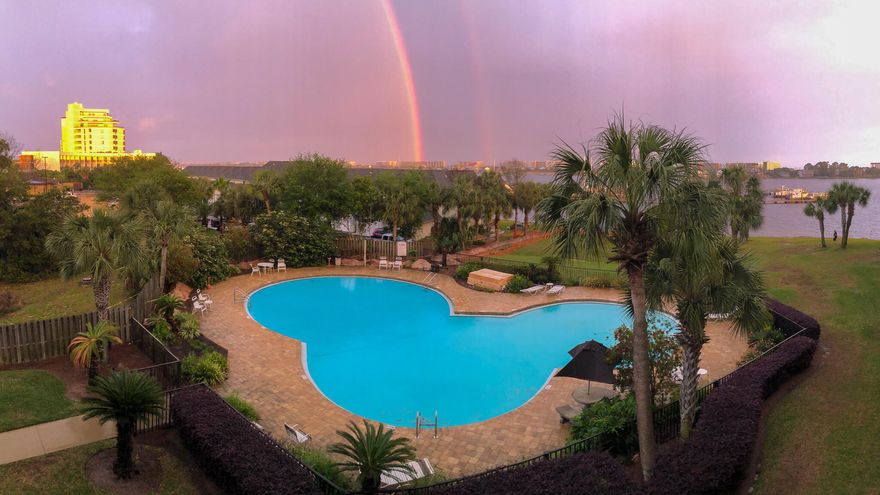 Renovated top to bottom in 2018 and professionally designed and furnished! NEVER BEEN RENTED! Unit upgrades and features are like none other at Pirates Bay. 40' Boat Slip (C9) included with sale. FULL SIZE WASHER/DRYER (Bosch) in unit. This 3rd floor unit offers spectacular views of the Santa Rosa Sound ... enjoy sunrises from your balcony! Wood-look ceramic tile throughout, quartzite countertops and matching custom soft-close cabinetry in kitchen (with ambient lighting above!), office, and bathroom... sellers had handcrafted Bedder Way Murphy bed (queen size) professionally painted to match cabinetry for a seamless look. FULLY EQUIPPED KITCHEN with stove, microwave, dishwasher & fridge. Bathroom has ample cabinet storage and tiled shower w/ glass door, bench, & two niches. See more -->