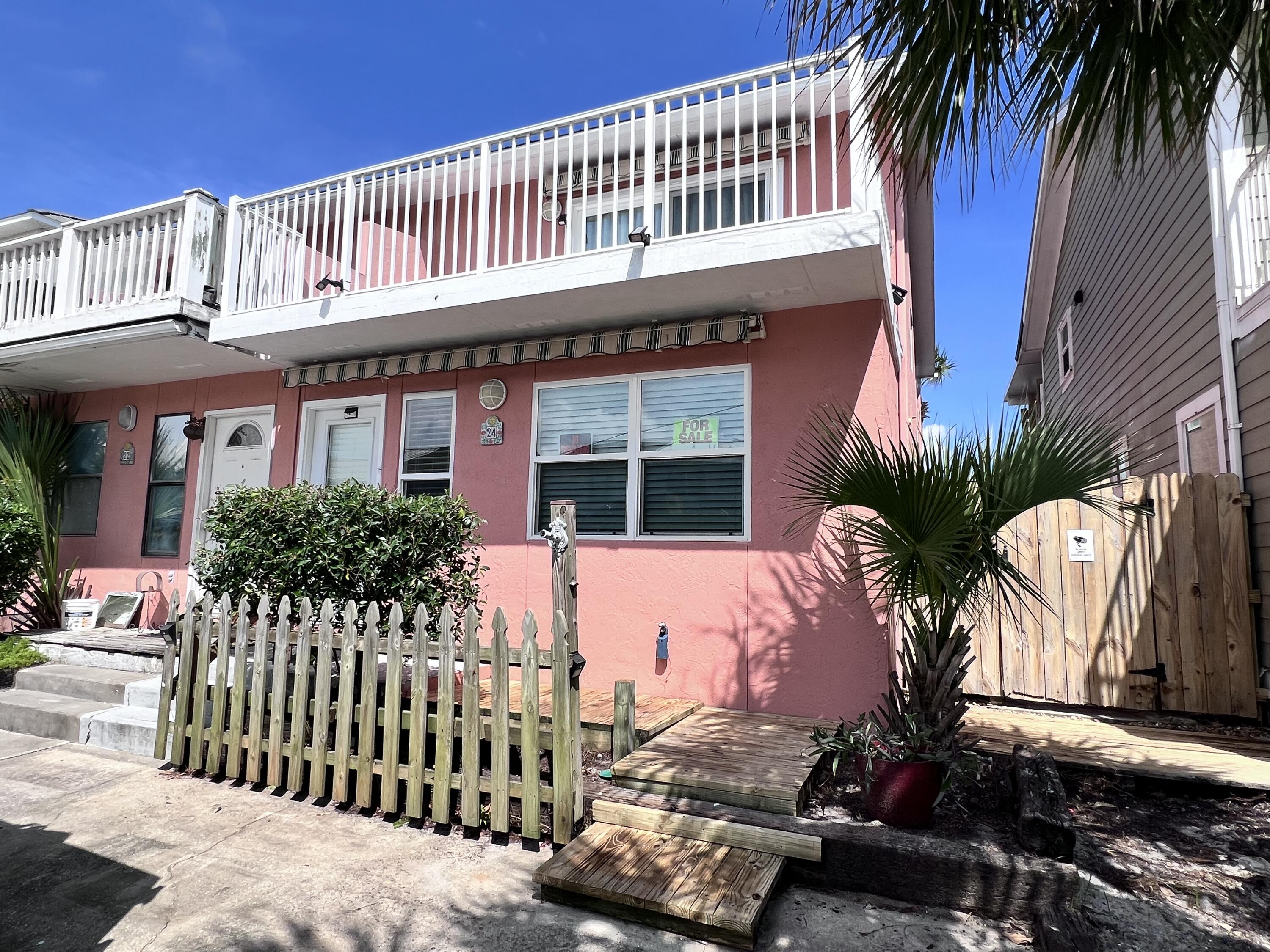 MOTIVATED SELLER! Bring Offers! This end unit townhome has a nice view of the inlet beach with great potential as a vacation rental or primary residence. Located on a private and quiet street, this 2 bedroom/ 2.5 bathroom house has a reverse floor plan with the bedrooms on the first floor and living space upstairs. The balcony is spacious and has a Sunsetter retractable awning to provide shade. The kitchen has stainless steel appliances that are all in excellent condition. Home has deeded beach access. A few cosmetic updates and this unit will really shine.