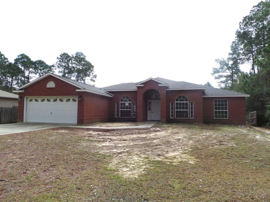 Move In Ready AND Price To Sell! This gorgeous brick home features four bedrooms two full bathrooms and over 2300sqft of functional floor plan with an open concept. Family Room is boasts high ceilings, plant ledges and open to the Eat-In Kitchen offers a center island, pantry and built-in microwave. Formal Dining Room has vaulted ceiling and beautiful decorative arched window that lets in natural light. Master Bedroom is spacious and Bath includes a jetted garden tub, separate shower and double vanity, double closets and dressing area. Home is convenient to beaches, boat ramps, restaurants, shopping and much more!