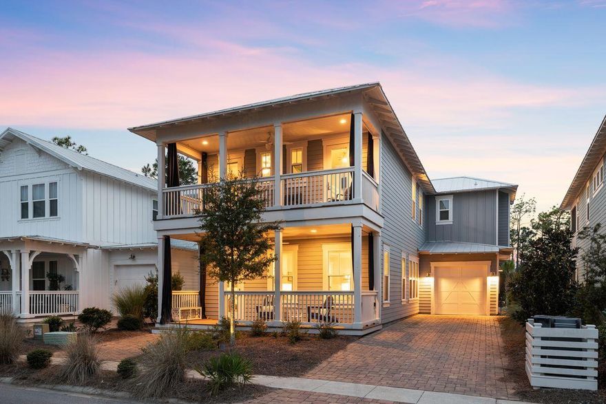 This superbly located home is destined for nature lovers and those who appreciate peace and serenity. Backing onto a scenic wildlife pond within the NatureWalk community, dragonflies and wading birds will be your closest neighbors. The flawless home sits comfortably within these surroundings with covered porches on both levels delivering panoramic views. Step through the open door into the first of two inviting sitting areas with wood flooring echoing the organic location. Check out the formal dining area before heading into the entertainer's kitchen. Seating five diners, the super-sized island will be the social hub for serving drinks and canapes in this well-equipped space. White Shaker-style cabinets create a crisp clean look along with stainless steel appliances, granite countertops and a contemporary backsplash. The rear porch has ample space for alfresco dining and relaxing. Seats on the paver patio create a gathering place for savoring uninterrupted views of the pond against the backdrop of Point Washington State Forest. You'll want to linger after dark, stargazing and toasting s'mores around the fire pit. This luxury residence has four bedrooms including a bunk room. The tranquil master suite has doors opening onto an upper porch for enjoying morning views of the pond and the sounds of nature stirring at first light. The capacious master bathroom has a freestanding oval tub, two separate vanities, a corner shower and an indulgent chandelier. The home comes with an extended garage and a discreet lock-out closet for storage. Days will be filled with nature hikes and bike rides, visits to the communal pool and social gatherings. White sandy beaches and delightful planned communities such as Seaside, Florida, and Seagrove Beach offer gourmet dining, shopping and entertainment nearby.