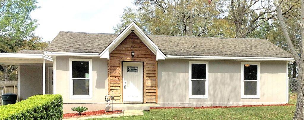 HOT NEW LISTING WITH INCREDIBLE UPGRADES! Don't miss out on this totally renovated 3 bedroom/1.5 bath (Jack&Jill style) home in the Carlisle neighborhood off Olive Road. Renovation features redesigned, open and light-filled floor plan with indoor laundry room. New, energy-efficient windows with hurricane protection devices, new flooring, amazing kitchen with quartz countertops, 42-inch cabinets, gas stove, stainless steel appliances, TANKLESS gas hot water heater, and new bathrooms make this home rise above the rest! Large corner lot with patio area, firepit and huge deck for outdoor entertaining. Dimension approximate. Buyer to verify.Bank pre-qualification letter required when submitting an offer.