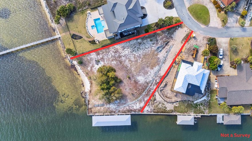Discover a rare and exceptional .57-acre corner waterfront sanctuary in the heart of Gulf Breeze. This is not just a lot; it's a lifestyle, now enhanced with three distinct floor plan options. Boasting an impressive 227+/- feet of waterfront, including 100' along a tranquil protected canal and 127' overlooking the breathtaking Santa Rosa Sound, this property offers unparalleled water access and panoramic views stretching from Pensacola Beach to Navarre. Imagine effortless boating with a pre-existing 18' x 70' double-slip covered boathouse, complete with power and a robust 18,000lb Golden lift. Enjoy the luxury of a private sandy beach area and the security of a seawall along the canal, with partial seawall and rip-rap along the sound. This is the ONLY available premium waterfront lot in an "X-Zone," offering the unique advantage of finishing out your first floor. Surrounded by multi-million dollar residences, this property ensures lasting value. Benefit from completed due diligence, including survey, topo map, boundary survey with MHWL, soil testing, a civil plan for a proposed home, AND three thoughtfully designed floor plans ranging in size, all included with the sale. Enjoy A-rated Gulf Breeze schools, proximity to shopping, Tiger Point Golf Course, and easy access to Pensacola Beach, downtown Pensacola, and Pensacola International Airport. Embrace the tranquility of the National Seashore just across the sound, guaranteeing unobstructed eastern views. This is your chance to secure the pinnacle of waterfront living in Gulf Breeze. Don't miss this extraordinary opportunity.
