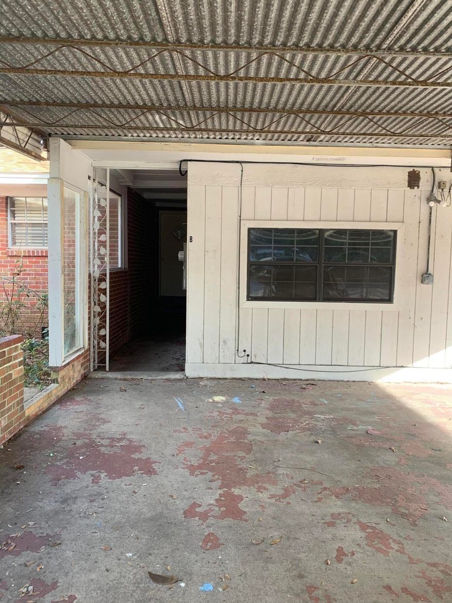 Two bedroom one bath unit in Niceville with a carport.
