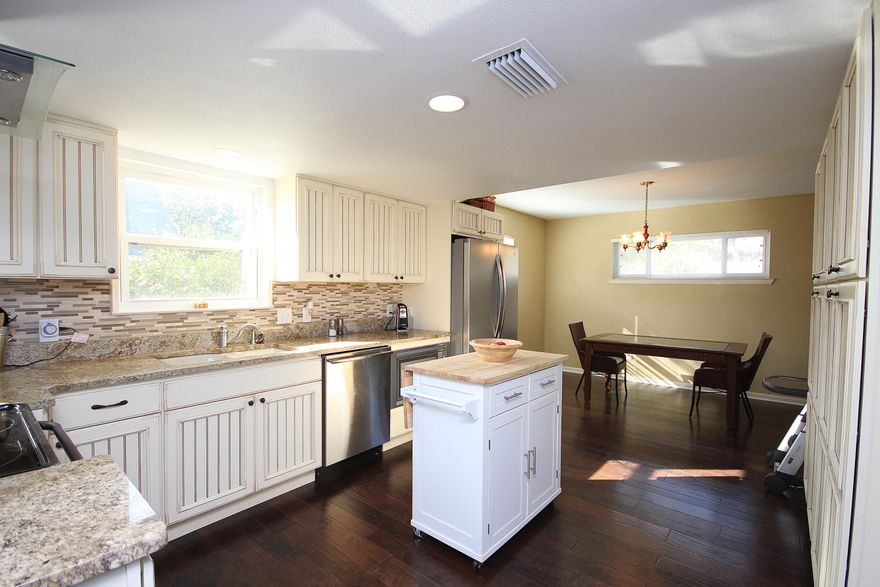 Home for sale in Shalimar, FL. Wonderfully updated home only 2 miles from Eglin AFB. Step inside and notice the hand scraped hardwood floors and beautiful paint colors throughout. The renovated kitchen features granite counters, stainless steel appliances, new cabinets, 2 pantries and a kitchen island. Don't miss the new windows, formal living room, dining room and family room with fireplace. The master bedroom has a sitting area, plenty of space for all your furniture, large walk in closet and master bathroom. There's a total of 4 bedrooms 2.5 bathrooms, plenty of storage and an inside laundry room. Out back you can enjoy the screened porch and large fenced backyard. Neighborhood features a waterfront park and playground park. FREE home warranty. Make your appt today.