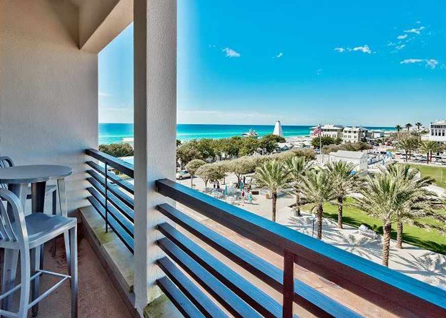 A VERY RARE FIND in Seaside! This wonderful retreat, located in the Dreamland Heights building, overlooks Seaside's bustling Central Square and Amphitheater and captures gorgeous views of the Gulf of Mexico. As you enter the unit you come upon a large Master bedroom that has custom cabinetry, designer draperies and an ensuite bath with spa tub. You then take a winding staircase to the 2nd level and enter the large great room. Here you have a barrel-vaulted ceiling, custom draperies, and high-end furnishings. You can also enjoy spectacular sunsets from the private balcony just off of the great room. This unit has been updated with Venetian plaster throughout, beautiful wood floors, updated windows and doors and new appliances. It is being sold ''turn-key'' and rental ready!