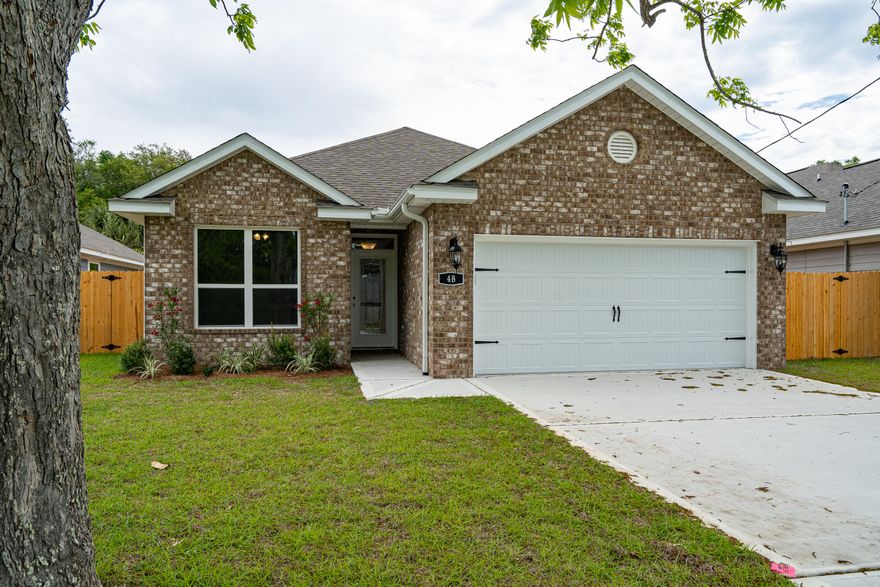 Beautiful new construction home in a lovely area of Shalimar. This home is very welcoming with 9' and 10' high ceilings, wood look tile flooring in shared living areas and carpet in bedrooms. Granite counter tops in custom kitchen and in bathrooms. Beautiful tile backsplash in kitchen. Covered back porch, large front yard with mature pecan tree. Landscaped yard with fenced back yard. Make this your next home.Buyer to verify dimensions and all important facts.