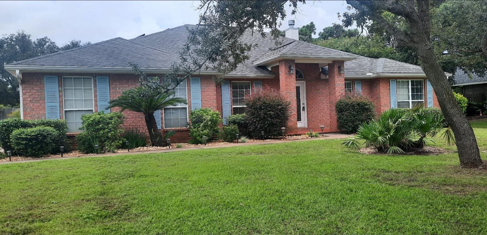 This move-in ready home offers 2,384 square feet of beautifully maintained living space on a sprawling half-acre corner lot in Holley By The Sea! Not only does this home have 4 bedrooms and 3 bathrooms it also has a fully enclosed heated/cooled Florida room that opens up from the main living area. From the Florida room you step outside and it opens up to the inground pool with a beautifully landscaped yard. This exceptional property sits on a prime corner lot with enhanced privacy and space, featuring seamless indoor/outdoor living that flows from the main living area through the year-round climate-controlled Florida room directly to the resort-style inground swimming pool surrounded by mature, beautiful landscaping. The home is completely move-in ready with fresh paint throughout and comes with incredible value-added features including a fully paid solar panel system. This property represents an exceptional value with immediate cost savings from the fully paid solar panel system that means significantly reduced electricity bills from day one. Water heater is from 2024 as well as a newer HVAC system! Don't miss this opportunity to own a piece of paradise! Schedule a showing today!