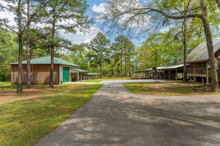 Live, Rent, Host, or Retreat - This Property Does It All. ** Motivated Seller -If you're looking for a property that offers flexibility, privacy, and income potential, this one checks every box. Whether you're planning for multi-generational living, need space for a second home business or event venue, or want the option to generate rental income, this estate delivers. The main residence features 3 bedrooms with en-suite bathrooms, plus a versatile loft with a half bath--perfect for guests, an office, or a private retreat. Inside, you'll find cypress walls and flooring, energy-efficient spray foam insulation, under-stair storage, and a comfortable split AC unit.Step outside to a 12x25 covered deck with a built-in TV area and a and a two-person hot tub great for relaxing There's also a hot water garden sink and outdoor shower for added convenience.

A major highlight is the 40x50 barn-dominium, built in 2017. It includes 2 additional bedrooms, 2 bathrooms, a full kitchen with gas stove, refrigerator, and two ice machines, one built-in and one free standing, all under soaring 16-foot ceilings. It's ideal as a guest house, rental, event space, or party barn.

The property also includes an enclosed 20x40 RV parking space with hookups, a 24x100 carport with electric and water plus an attached 18x32 lean-to, and a 12x50 covered area perfect for additional storage or entertainment space. A private gun range and a chicken coop add even more value for those seeking a self-sustaining lifestyle or recreational use.

This property offers a unique lifestyle with the flexibility to live, host, rent, or retreat. Whether you're an investor, a growing family, or someone seeking room to spread out, this estate is ready to meet your needs