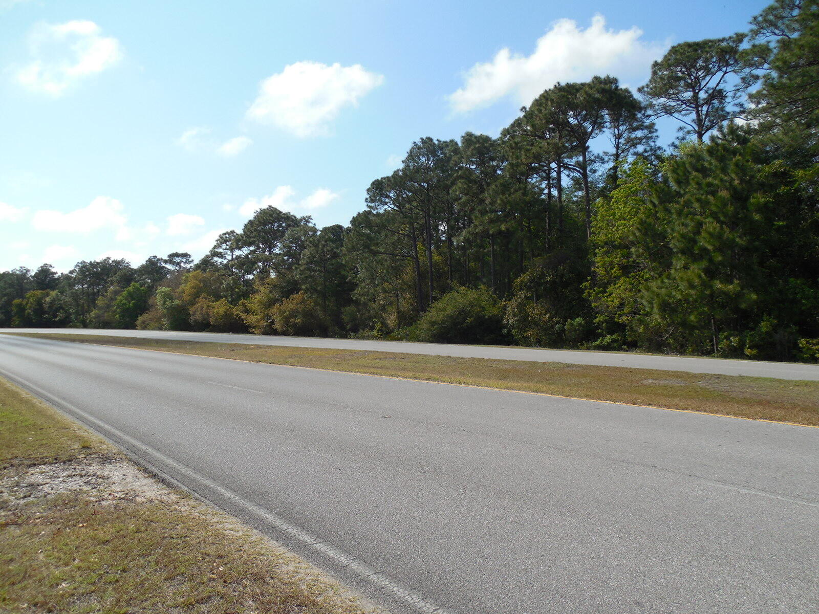 Rare commercial vacant lot 1.185 acres in size zoned for Mixed Use with 415 ft of highway frontage on Independence Road going into the back gate at Hurlburt Field AFB is available for immediate commercial or residential development. With its versatile MU zoning for mixed use, it can have several uses to include C-2 Commercial Uses and R-1, R-2, SR, and R-3 residential development. Some possible uses of this property include duplexes, triplexes, townhomes, retail/shopping center, food service establishments, offices, storage, parking and temporary housing. Bring all offers, seller is motivated and has priced this property to sell. Water appears to be available, and sewer may be available or is at least close by. Electric power is close and was confirmed that it can be easily provided. Call Chuck Roland at (850)685-2418 for more information. Buyers are responsible to verify all measurements and pertinent information.