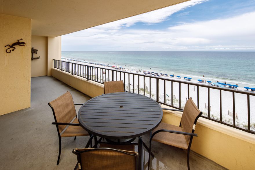 Beautiful direct Gulf views from this 6th floor unit. This large 2bedroom 2 bath has been updated by the owner and is in a great location. There are tile floors throughout the living and kitchen along with crown molding in living room. The bedrooms are oversized and the second bedroom fits two queen beds with ample room. The oversized balcony spans the living room and master bedroom.  The master features a large bathroom and huge closet.  Surf Dweller has onsite fitness, tennis courts, a picnic area, gulf front pool, and kiddie pool.  Call to see it today. Buyer should verify all information.