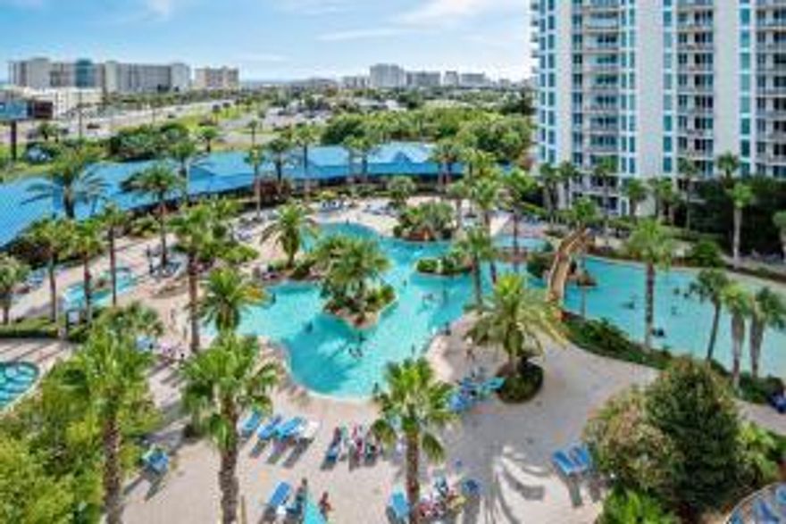 This two-bedroom 2 Bath condo offers an open concept living and dining area, as well as an inviting 8th floor balcony overlooking the pool with gulf views. Guest bedroom has an addition private balcony.   The lagoon pool and water features are the resort's crowning attractions. Onsite amenities include multiple pools with waterfall features, a hot tub, playground, fitness center, and tennis and basketball courts. On-site restaurant offering lunch, dinner, room service and even in-season poolside service. Shuttle service to the June White Decker Public Beach access is offered in-season. All utilities are included in HOA dues  water, sewer, electric, cable, WiFi, phone, trash! Excellent opportunity for a vacation rental, second or primary home,Listing Agent is a Trustee of HT Land Trust