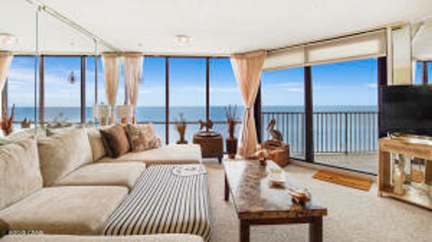 NEW AC UNIT/ NEW WATER HEATER AS OF JUNE 3, 2025! This expansive, Gulf-front two-bedroom, two-bathroom condominium is nestled within the highly sought-after mid-rise Windward building, situated on the serene west side of Edgewater Beach and Golf Resort. From the moment you step into this third-floor residence, you are greeted by breathtaking, panoramic views of the sugar-white sands and mesmerizing, emerald-green waters of the Gulf of Mexico. Floor-to-ceiling windows spanning the living room, dining area, and kitchen ensure an uninterrupted coastal vista, flooding the space with natural light and an unparalleled sense of openness. A distinctive highlight of this unit is the striking reflection of the nearby pier, elegantly captured in the living room mirror--a truly unique touch.