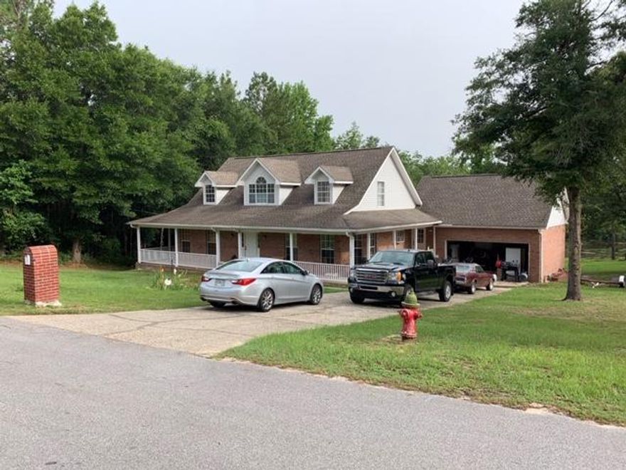 This is a must see home that has it all! Large home on 1.33 acres with 150' oflakefront. Home features 4 bedrooms, 2.5 baths, a large 2 car garage and a basement.Master bedroom is on the first floor with two walk in closets. Master bath has doublevanities, a whirlpool tub and separate shower. Kitchen has stainless appliances, thegas cook top is on the island and there is a breakfast bar.the lake and has a gas fireplace. French doors lead out to a 47' deck. There is newLVL plank flooring recently installed on the first floor. There are two bedrooms withwalk-in closets upstairs along with a large bathroom and a sitting area. The 4thbedroom is on the first floor. The dining room overlooks the water. It could also beused for an office or exercise r