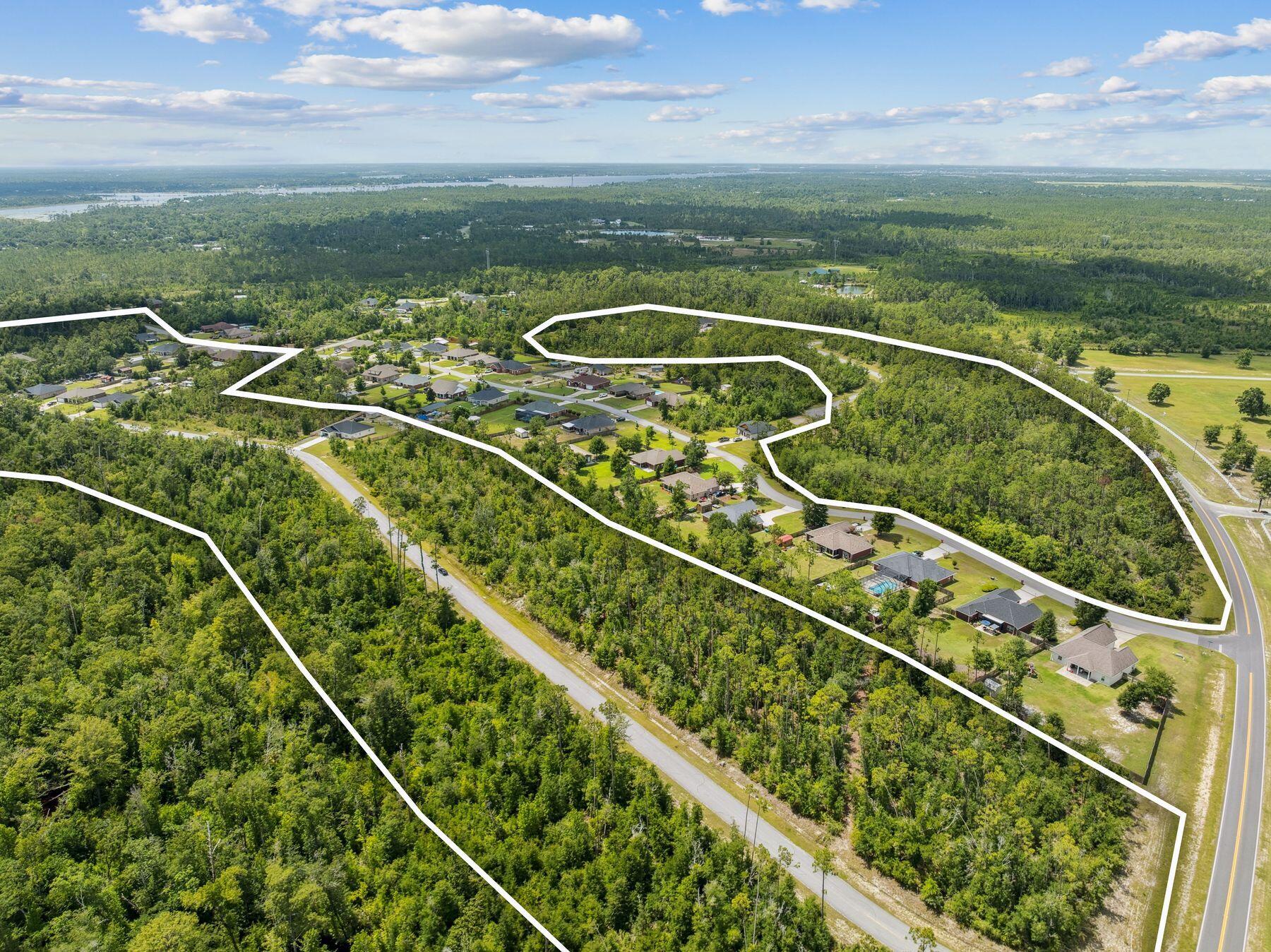 An exceptional opportunity awaits with this bulk offering of 70 oversized residential lots in the established community of Cedar Creek Chase. Ranging from one-half to three-quarters of an acre -- and some stretching to nearly a full acre -- these parcels offer generous room to build, expand and enjoy the peaceful pace of life in a natural setting. Many lots offer preserve views, and all are set within a quiet enclave just north of Panama City and east of the Northwest Florida Beaches International Airport.With paved streets and water infrastructure already in place, the groundwork has been laid for future development. The area is currently on septic, and the rural charm of Cedar Creek Chase enhances the appeal for those seeking space, privacy and a slower rhythm. Located in Southport, this community offers easy access to the outdoor recreation of Deerpoint Lake and the white sand beaches of the Emerald Coast, along with proximity to local schools, shops and services.
This bulk sale represents the final developer-held inventory in a thoughtfully planned neighborhood known for its generous lot sizes, established greenery and enduring appeal. Whether held as investment or developed for resale, these remaining lots offer immediate potential and long-term value in a growing section of Bay County.