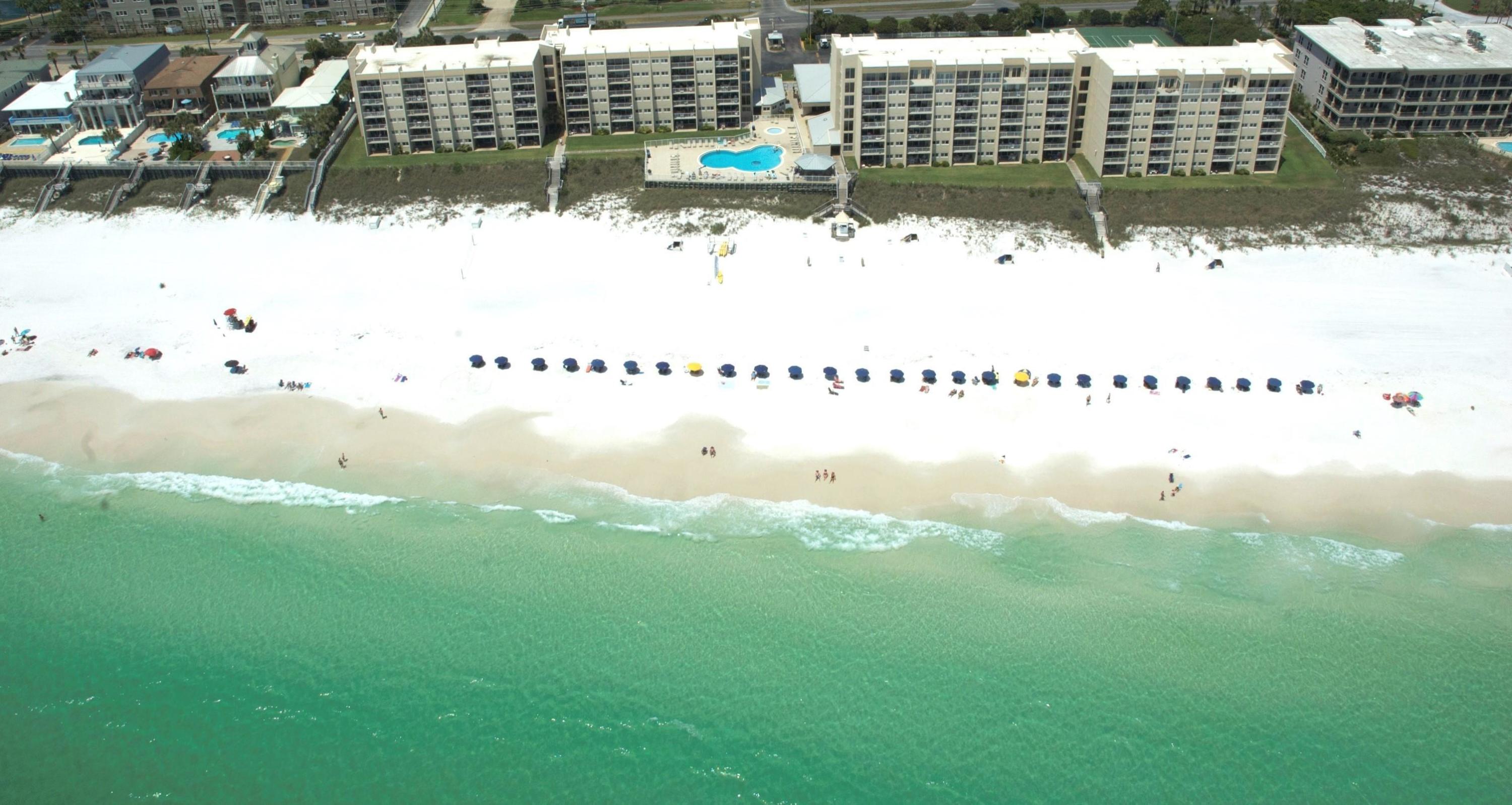 Gross Rental $58K (2017)st Rare opportunity like none other UTILITIES ARE INCLUDED in the HOA FEES. Gulf Front Beach House condominium located on Scenic 98. Well sought after condominium complex. These units rarely come on the market and they sell quickly. Beachfront heated pool, umbrella/chair service, gated with security guard, 2 tennis courts, shuffle board, gazebo and clubhouse. Owners have updated every room: installed granite, new bathrooms, tile, appliances, crown molding, smooth ceilings, lights and more. Two new leather recliners will be delivered March 15. New HVAC installed 2016. This is a family-oriented complex, with great ocean front pool, beach service from March - October. You will be wowed by the views, lulled by those glorious waves, and awakened to dolphins and ser