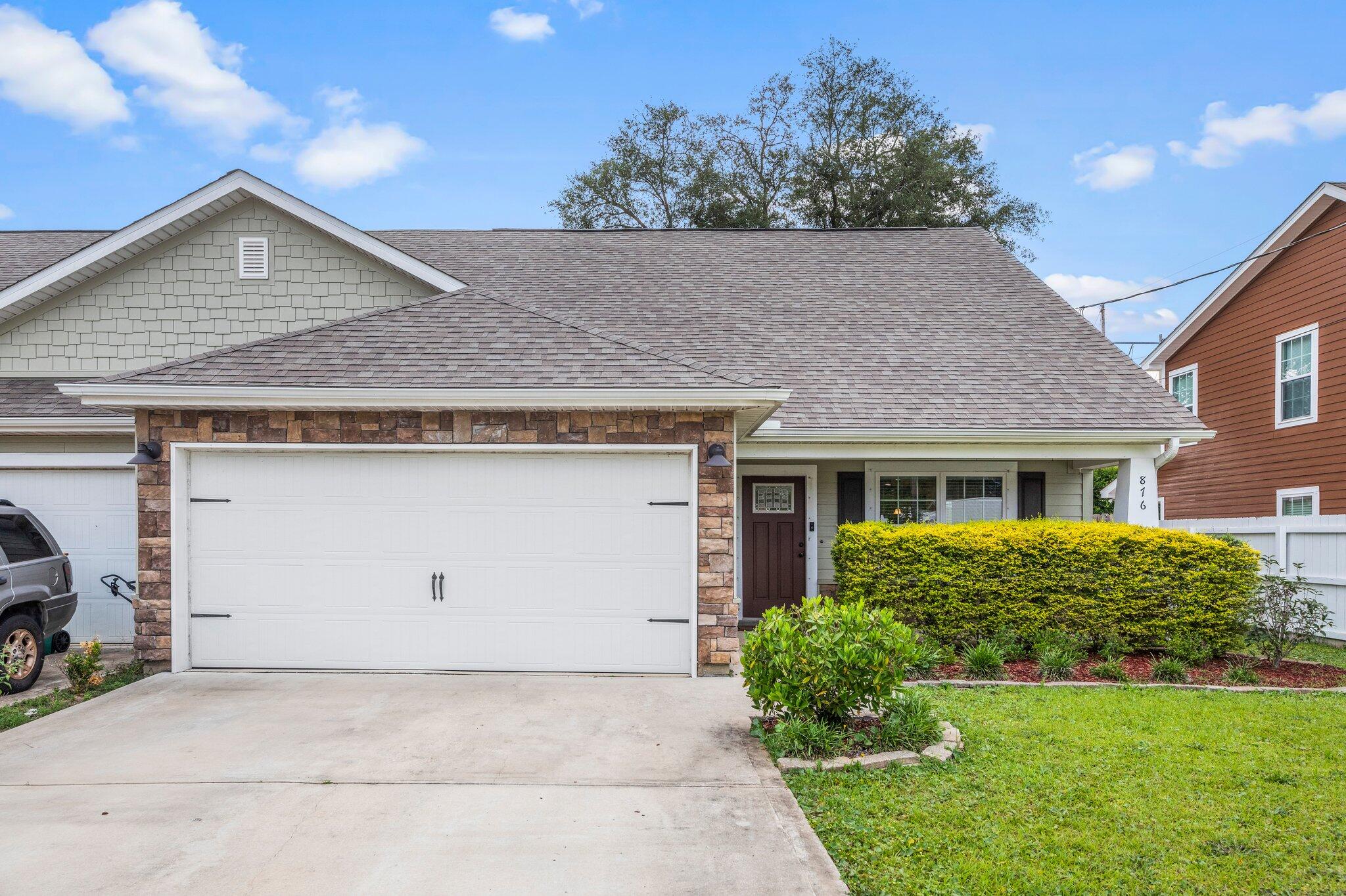 Welcome home to this absolutely stunning 5 bedroom, 2.5 bath craftsman style fully updated townhome located in the heart of Fort Walton Beach. This townhome is convenient to Eglin Air Force Base and Hurlburt Field! Pull up in the large driveway and appreciate the well cared for curb appeal, and after passing through the covered front patio you'll enter and love the large tile throughout the common areas. Enjoy a spacious living room open to the fully updated kitchen featuring stainless appliances, granite countertops, bronze fixtures, and pantry. You'll also find a separate eat in kitchen space and a conveniently located half bathroom downstairs. The primary bedroom is also located downstairs with the beautiful bathroom featuring matching granite dual vanities and bronze fixtures,