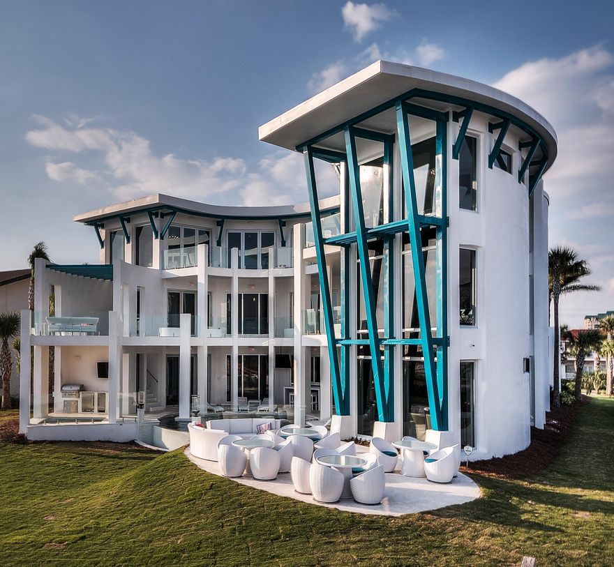 Embark on a journey to beautiful Gulf-front living, down Destin, Florida's Holiday Isle. Arrive at a bracingly original, private retreat known as Destin Jewel, a newly constructed sanctuary that perfectly blends the spirit of nature with sophisticated fabrication. Experience the harbor's distant jetties, three miles of snow-white beaches, and an occasional school of dolphins from your own secluded paradise. This stylish Gulf-front residence is designed to rival the world's finest resorts and incorporates the highest-level construction standards. Exterior walls are poured concrete over steel I-beam construction and are built to withstand wind speeds of up to 150 MPH, equal to a Category 4 hurricane. Vacation rental income will top $700K in 2018. Destin Jewel is an iconoclastic luxury landmark with a landscape reflective of simple Florida living. Privacy equals tranquility on over an acre of gulf front property with one hundred feet of gulf frontage. Views of the Gulf of Mexico's aquamarine waters and the harbor's distant jetties are unparalleled with more than three miles of shoreline visibility. Natural stone pavers lead the way to minimalist, modern design accentuated by a blue metal roof and aqua-colored decorative cladding. The owner conceptualized this home's crescent-shaped design and renowned Archiscapes Architects completed the ideation, which seamlessly blend indoors and out. Destin Jewel incorporates five-star amenities in three stories and 9,000 square feet of heated and cooled living space plus an additional 5,000 square feet of balconies and outdoor hardscapes, Your adventure to sublime continues as you enter to a 35' foyer where walls of glass draw your attention to the unforgettable sea's still waters. Before venturing outdoors, you pause for a moment to take in the chic chandeliers and the striking circular glass elevator. A stunning wood and glass free-form staircase, accented by subtle LED lighting wraps around the elevator and leads dreamily upstairs. Minimalist, neutral interiors, natural limestone floors and clean-lined European cabinetry sit quietly and seductively, encouraging all eyes to remain on the dazzling outdoors. From every vantage point, multi-hinged walls of windows fold into obscurity allowing all eyes to marvel at miles of unspoiled beaches. Glass wind reduction railings adorn deep outdoor balconies allowing the admirer to float above emerald green waters. A decadent, free form, custom, infinity pool is located just outside the first-floor living spaces and is visible from all floors. This luxurious pool delights all the senses and calls for dramatic appreciation of the pool's central fire feature with glass enclosure and accent fire torches, theatrical LED accent lighting, two swim-up bars, and an in-pool sundeck. This entertainment oasis is remarkable and is certain to be central to all activity in the home including meals, compliments of the connoisseur's outdoor kitchen. Gulf-side outdoor seating accommodates large parties in stylish furnishings. Located separate from the pool, the heated spa with seating for 12 features an independent HD TV and audio system and two separate massage jet motors for each person. Anti-glare TV screens line the outdoor oasis for a total of 19 total Smart TVs through the home. A surprise, regulation sized, sand volley board court sits just beyond the manicured grass lawn and just below the natural dunes. The home's main floor kitchen is any chef's indulgence. Precise design conceals the complexity of futuristic appliances and perfection in maneuverability. Light reflecting marble countertops, a striking yet simple glass tile backsplash, copper sinks and fixtures, and sleek striated-white oak cabinetry echo the home's timeless detail. The central kitchen includes two full size 30-inch Subzero refrigerators, two full 30-inch size Subzero freezers, three sinks, two dishwashers, a three-burner gas range, and a four-burner magnetic cook top. The elegant living room encourages guests to gather and is serviced by a fully equipped bar with a commercial wine refrigeration. First floor, banquet-style dining seats twenty-five, and bar seating accommodates an additional ten. If indoor entertainment is on the agenda, move to the spirited state-of-the-art theater with a 119" projection screen and Dolby Surround Sound. Cosmopolitan appeal meets southern comfort in seven gulf front bedroom suites and a playful two-bedroom children's wing. Each of the seven private suites is the pinnacle of style and relaxation. In each en suite, an unexpected jewel tone is added to hand-painted, poured concrete flooring and custom lighting for a striking contrast to otherwise neutral tones. Luxurious private baths incorporate ultimate creature comforts and the whimsy of unique glass tile that continues the jewel theme from the bedroom. The second floor gathering space, reminiscent of a luxury cruise liner's bar, blends football colored leather and striated-oak cabinetry for a masculine feel. Three 55" TVs line the bar's backdrop for endless viewing pleasure. An expansive harbor party deck and an additional private balcony cigar lounge compliment the bar area.
The kid's suite will enchant the younger set. Concrete floors are hand-painted with the wonders of the ocean. Two custom-crafted birch bunk beds imitate the lore of pirate sailings. Custom painted mermaids peak over the ship's bow, luring the slumbering child out to sailing. Additional sleeping quarters adjoin the ship's bedroom. Both bedrooms can easily accommodate twelve children. The children's bath combines bright colors and hard surfaces for ultimate durability. The double shower and triple sink ensure that there is no need to fight for bathroom time. The home's third floor includes a lounging area, and each floor incorporates laundry facilities. This smart-home design is controlled via in-home touchscreens. The security system, wireless system, and thermostatic controls are all enterprise grade. The cost to own this impressive home is low.  Qualified purchasers are invited to tour this luxurious beach home. Call for your opportunity to experience this remarkable testament to exceptional living.


