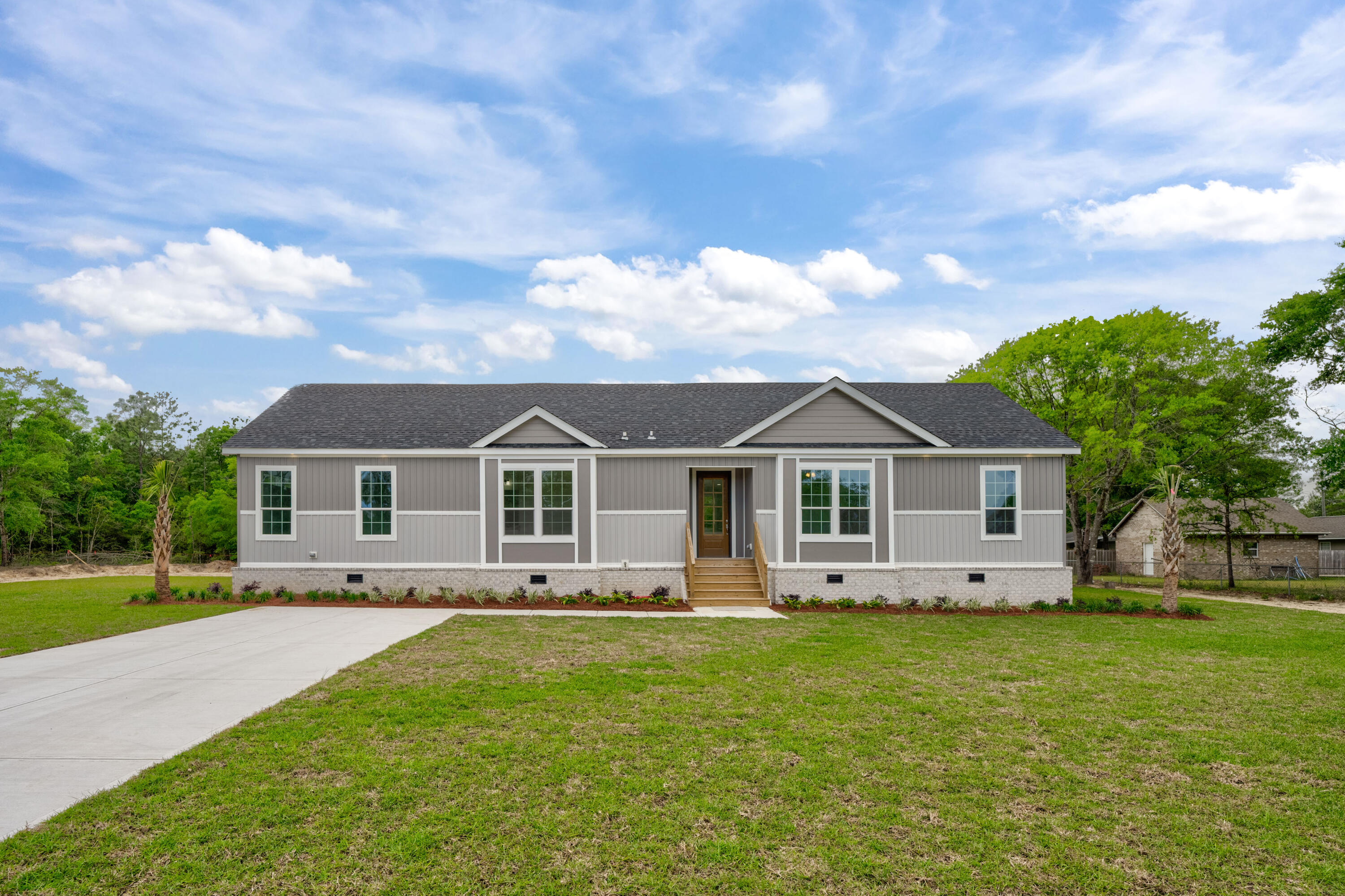 Discover Your Perfect Retreat: A Harmonious Blend of Modern Elegance and Classic Charm. Welcome to a residence where comfort meets style! This exquisite modular home is a true sanctuary, designed to fulfill your dreams. As you step inside, you're welcomed by a bright and airy open-concept layout that invites warmth and connection. The spacious living areas are bathed in natural light, creating an uplifting atmosphere throughout. The gourmet kitchen is sure to impress culinary enthusiasts, featuring high-end stainless steel appliances, chic countertops, and generous storage solutions. Imagine hosting delightful dinners in the adjoining dining area, perfect for making lasting memories with family and friends. Unwind in the cozy living room, complete with an electric fireplace that enhances the inviting ambianceideal for those intimate moments under the glow of flickering flames. This home marries contemporary design with timeless comfort, making it the perfect place to start your next chapter.  Don't miss the opportunity to make this beautiful home yours!
