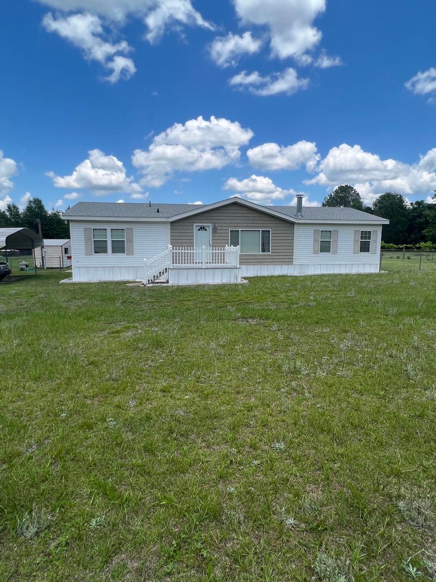 Looking for a move in ready home on a large lot? I invite you to come and view this 3 bedroom 2 Bath home fully fenced on 1 acre. Lots of room for outdoor activities. Master bedroom has double closets, garden tub, and separate shower. Property conveys with large carport, 3 storage buildings (one with a garage door) Roof 2018. Sold AS-IS. Property is currently going through probate and is contingent on the authorization of the probate court.