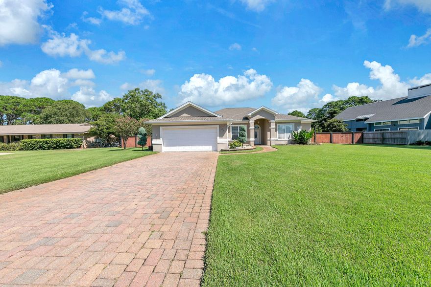 33 E Country Club Drive offers luxurious indoor living as well as the opportunity to enjoy the scenic beauty and recreational possibilities, provided by Indian Bayou Golf Course and Country Club. Being situated between the 8th hole green and 9th hole tee-box, provides a haven from stray golf balls, while enjoying leisure time in the pavilion or pool area of this giant, fenced in back yard. The interior of the home is equally impressive, with large rooms and fine finishes! The pictures do it great justice but you'll want to get in and see it for yourself ASAP!