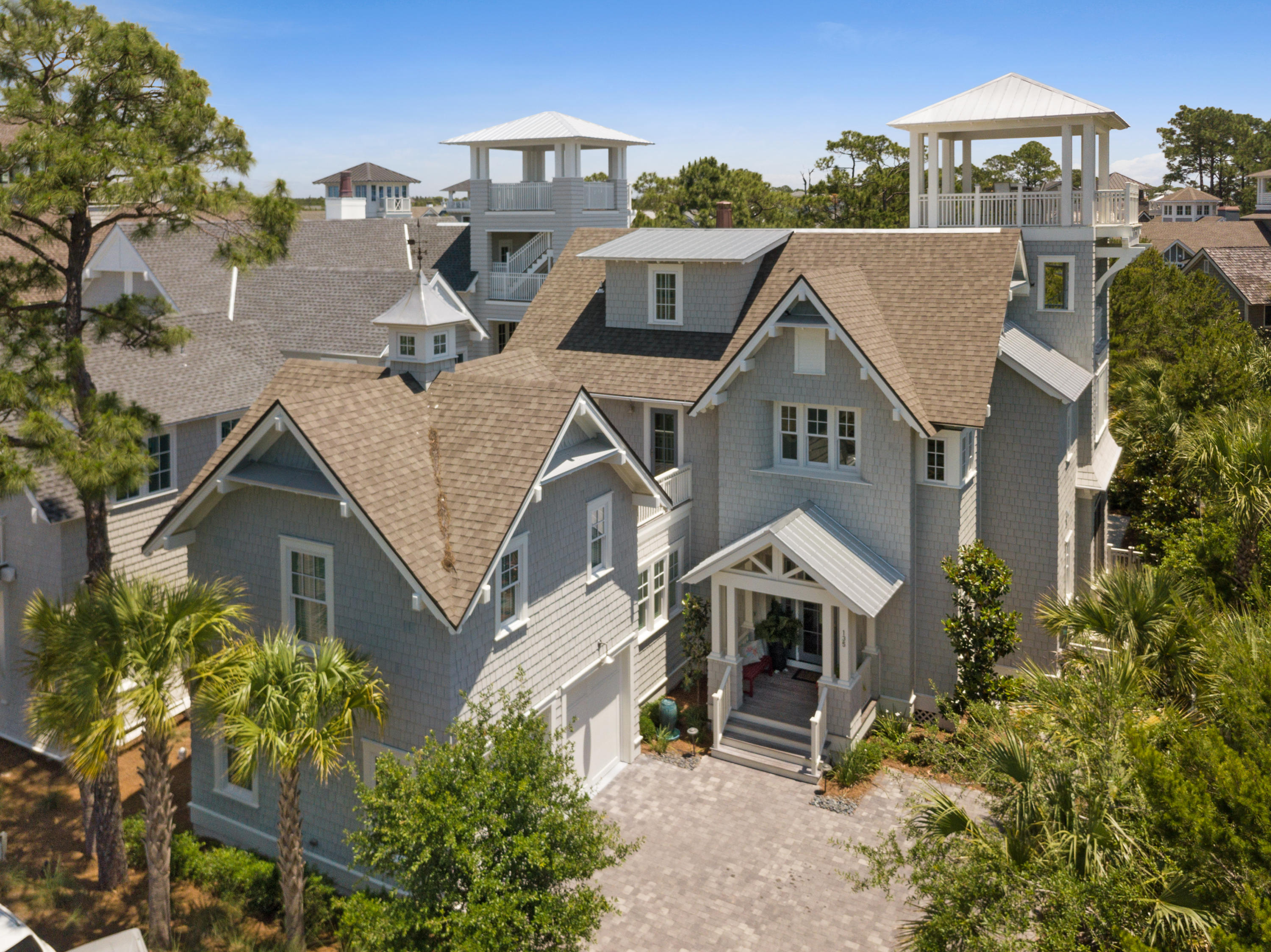 Spectacular luxury home in WaterSound Beach with gulf views!! This home features 4478 heated/cooled square feet, 5 bedrooms, 5 1/2 baths. Large kitchen dining area open to a beautiful great room overlooking the pool area. Incredible kitchen with custom cabinets from Gulfsouth Kitchen Designs, Thermador appliances, pantry, and island. Outdoor side screened in dining porch with built in grill and stone back splash. 10'x15' pool w/ spa attached and terrace area for outdoor furniture. Pool bath vanity is an antique coffee grinder modified for a top and vessel sink. The first floor also offers a 2nd master with the main master on the 2nd floor. 2nd floor master includes vaulted wood ceilings, private porch and small balcony overlooking the pool. Large master closet complete with built-ins