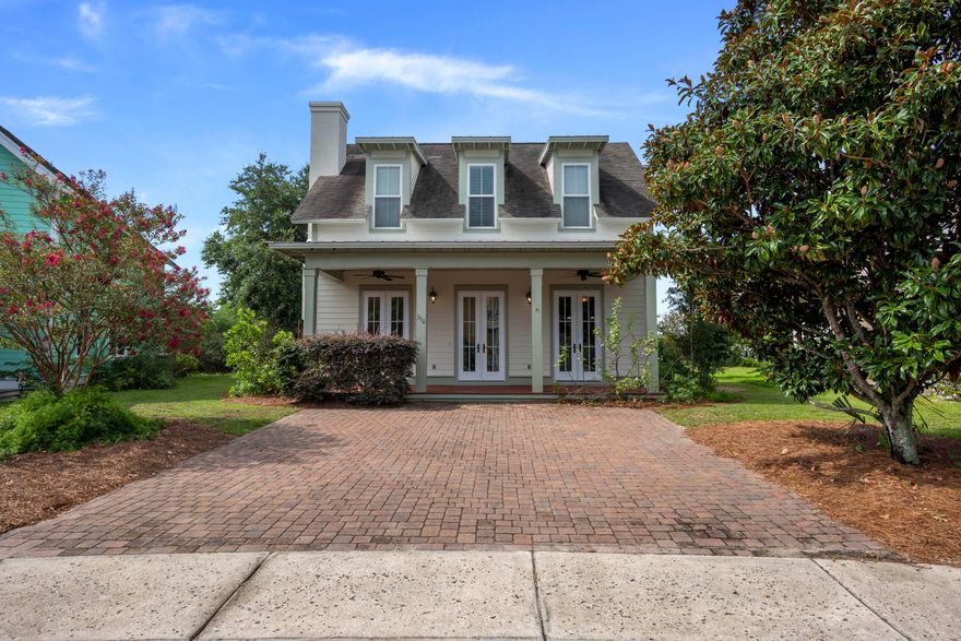 Beautiful 4-bedroom, 3.5-bath home in Harrison's Walk, a great community close to the beach. Incredible price for a home this spacious and close to the Gulf of Mexico! New exterior & interior paint! This home has great curb appeal with a covered front porch and brick paver driveway. Interior offers beautiful tile floors throughout the common areas, raised ceilings, and great natural light. Craftsmanship details like crown molding and white wainscoting give the property a beach cottage feel. This is a fantastic open floor plan with a ground floor master bedroom for added convenience and three guest bedrooms on the upper level. Great kitchen with wood cabinets, expansive granite countertops, & a breakfast bar with pendant lighting. All bathrooms feature granite and new carpet in all rooms.