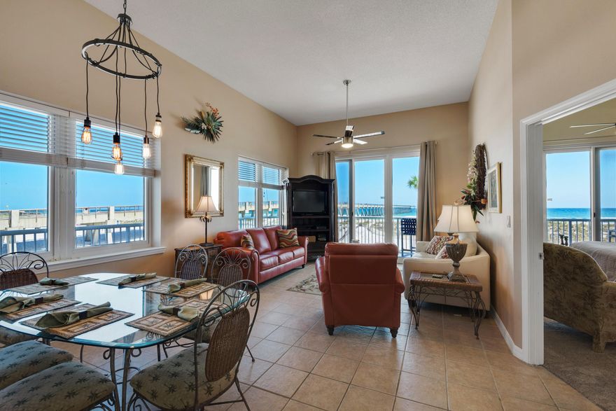 SPECTACULAR UNIT W/BREATHTAKING VIEWS OVERLOOKING GULF & PIER. Sunny END unit has Lg. side windows, sliding door to unique wrap around balcony that boasts panoramic views! Unit comes w/COVETED ASSIGNED COVERED PARKING SPOT. Great rental-$35K+. Easy access entry to unit is nestled in a separate quiet walkway.
Soaring 12 FT ceilings give spacious residential feel. Large bedrooms. MASTER: Gulf Views from window & sliding door to balcony. MASTER BATH: Soak tub, separate shower & Dbl Vanities. 2nd BR has own bath. 3rd BR has private access to hall bath.
NEW ITEMS: Kitchen Appliances, Master BR carpet, Draperies, Living Rm furniture, Ceiling fans.
AMENITIES: Beach access from Gulfside pool, BBQ grills, exercise Rm., etc. WALK to Restaurants, Pier, State park beach access. THIS IS A MUST SE