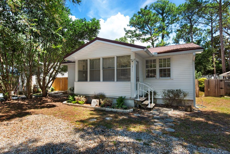Charming 1970s Florida Cottage - Perfect Blend of Nostalgia and Modern Comforts! This delightful home located in the heart of Niceville, has a remarkable history. It originally served as officer quarters on Eglin AFB. It was relocated to its present location and renovated into a 2 bedroom, 2 bathroom cottage. Move in ready and nestled on a peaceful street, it exudes warmth and character. It has a great open floor plan, metal roof, vinyl siding, and brand new back deck. Each of the bedrooms boasts natural light and cozy spaces, with closet cubbies. (Not huge, but just enough to store your stuff.) Outside, the large fenced in backyard is perfect for kids and pets to run and play. Plus a large metal storage shed and enclosed front porch. This home offers so much! Come and see this gem today!