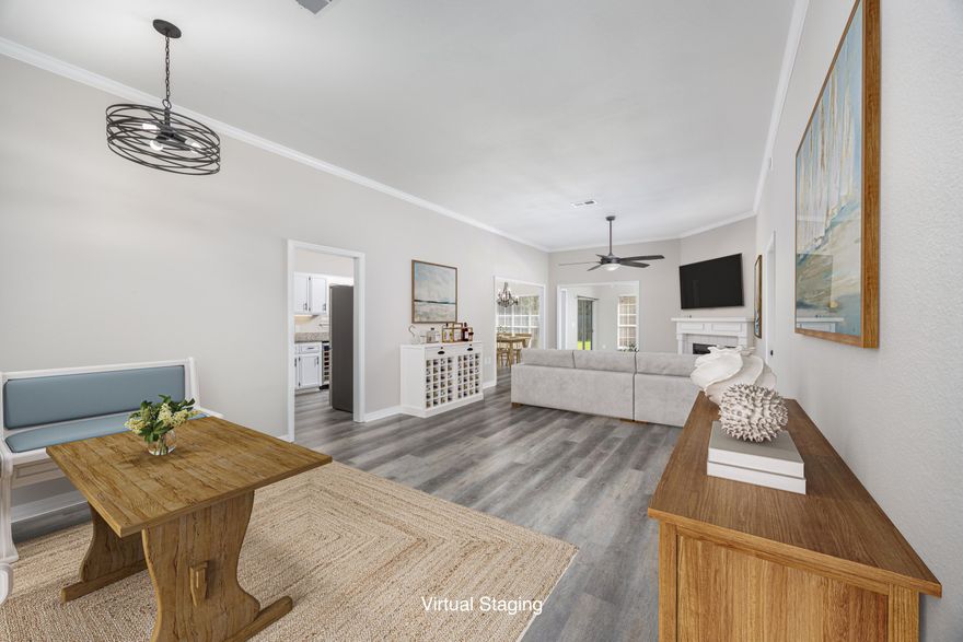Welcome to this beautifully maintained 3-bedroom, 2-bath single-level home in the Bay Colony neighborhood within the Tiger Point subdivision of Gulf Breeze, Florida. Bring ALL your toys--this unique property offers abundant storage for your boat, RV/motorhome, camper, jet skis, golf cart, kayak, and more. Skip the storage facility--there's a private rear driveway leading to a 42'x21' spacious pole barn/carport equipped with full RV hookups and power, making it perfect for adventure seekers and outdoor enthusiasts.This home offers peace of mind with major updates including a new roof in 2023, brand-new HVAC system in 2024, and a new lawn sprinkler system and pump installed in 2024. Inside, you'll find elegant crown molding throughout, a modern kitchen with granite counters, stainless steel appliances, and a wine cooler, ideal for entertaining. The living room opens into a cozy family room, leading out to a paver-lined backyard patio, perfect for relaxing or hosting guests. A charming covered front porch adds extra curb appeal and a welcoming touch.

Located just 0.1 mile from the Soundside Foundation Nature Preserve path and 1.2 miles from the Tiger Point Sports Complex, you'll enjoy easy access to trails, ball fields, playgrounds, and community events. This property offers freedom and flexibility to fully enjoy your coastal lifestyle.

Don't miss your chance to own a move-in-ready home with room for everything, and everyone you love.