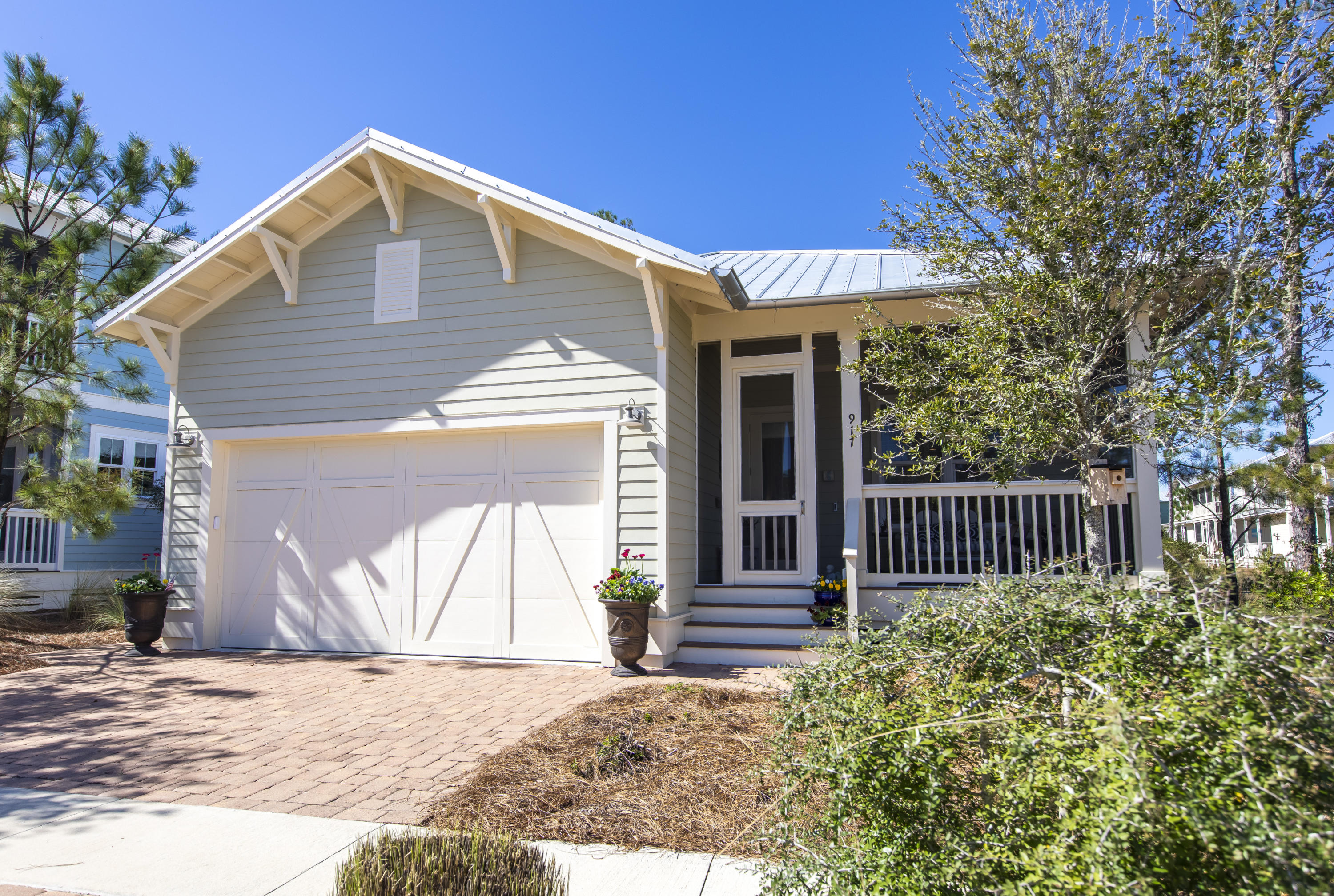 NATUREWALK in Seagrove Beach...beautiful home has never been on the rental market. This 3 bedroom, 2.5 bath Beachwind plan is on one of the larger cottage home sites backing to preserve and has pond views. The floorplan features a large family room with fireplace and opens to a beautiful kitchen with breakfast bar. The kitchen finishes include Shrock quality cabinets with soft close drawers, granite countertops, tile backspash, stainless steel appliances including gas cooktop and GE monogram hood. The spacious master suite has tray ceilings, huge walk-in closet off the master bath, and glass walk-in tiled shower. You will love the screened in front porch and back porch which offers lots of privacy overlooking the preserve area and pond. Some of the many upgrades include: