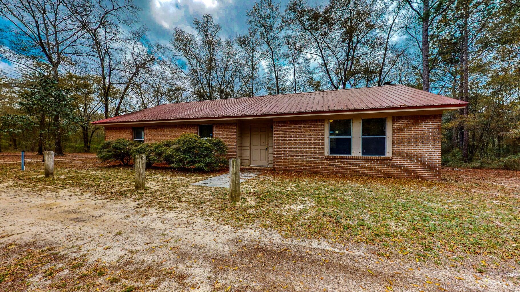 Great opportunity! Three bedroom, two bathroom, one story brick home on almost four acres! This home is very spacious with over 1800 square feet and featuring two living spaces and an eat-in kitchen! There is a master bedroom with en-suite bathroom and two additional bedrooms and full additional bathroom, This property is accessed by a long driveway and feels completely secluded and private! Background check , credit check, employment verification and references will be required! Pets are allowed upon approval and with non-refundable pet fee! Requirements are household income is $4,250, employment must be one year consistently unless you are moving here for employment, and a credit score minimum of 600.