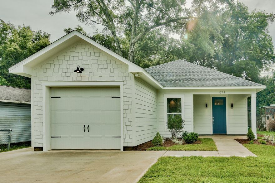 Welcome home! This adorable new construction 3-bedroom, 2-bath home is centrally located minutes from Downtown with almost 1600 sq ft and a one car garage. The attention to detail and quality of work is showcased from the moment you walk through the nautical blue door. The spacious open floor plan features a large living area, kitchen/dining combo and luxury vinyl plank flooring throughout. Just off the garage is a separate mud room and office with plenty of natural light and antique wood doors, this space offers endless possibilities! The custom designed kitchen boasts a Georgia marble island, Quartz perimeter countertops, custom made fixtures, handcrafted floating shelves and top-of-the-line appliances. The graciously sized master bedroom showcases a walk-in closet with built-ins and